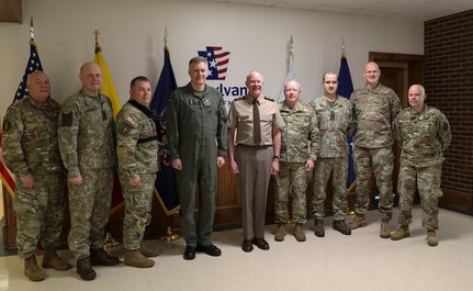Col. Antanas Matutis, Commander of the Lithuanian Air Force, Command Sgt. Maj. Alvydas Tamošiūnas, Senior Enlisted Leader of the Lithuanian Air Force, and Maj. Romualdas Gečionis, Military Assistant to the Commander of the Lithuanian Air Force, begin a nearly week-long visit to the United States by meeting with Pennsylvania National Guard key leaders including U.S. Army Maj. Gen. Mark Schindler, acting adjutant general, U.S. Air Force Brig. Gen. Michael Regan, deputy adjutant general- Air, U.S. Army Command Sgt. Maj. Jon Worley, senior enlisted leader, and U.S. Air Force Col. Donald O’Shell, director of staff- Air, March 20 at Fort Indiantown Gap. (U.S. Army National Guard photo by Sgt. 1st Class Zane Craig)