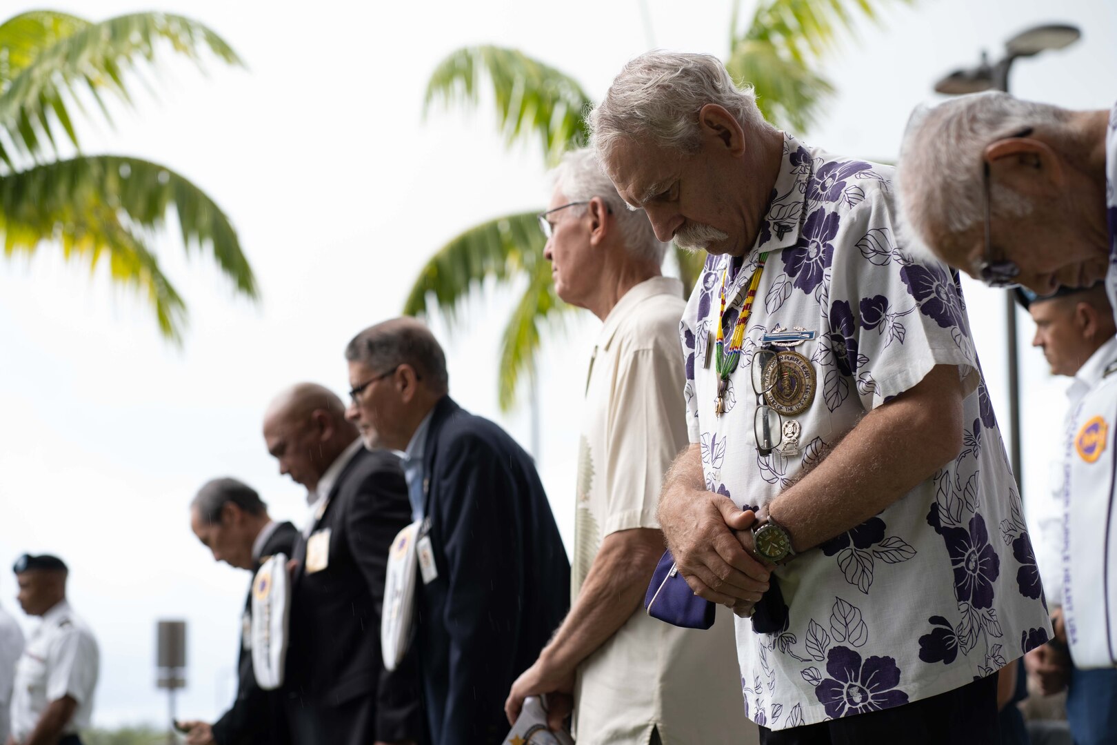 Attendees of the 50th anniversary of Operation Homecoming ceremony, bow their heads during the invocation at Joint Base Pearl Harbor-Hickam, March 28, 2023. Following the release of U.S. Prisoners of War by the North Vietnamese, the newly freed U.S. service members were brought back to JBPHH and touched down on U.S. soil for the first time. (U.S. Marine Corps photo by Sgt. Zachary T. Beatty)