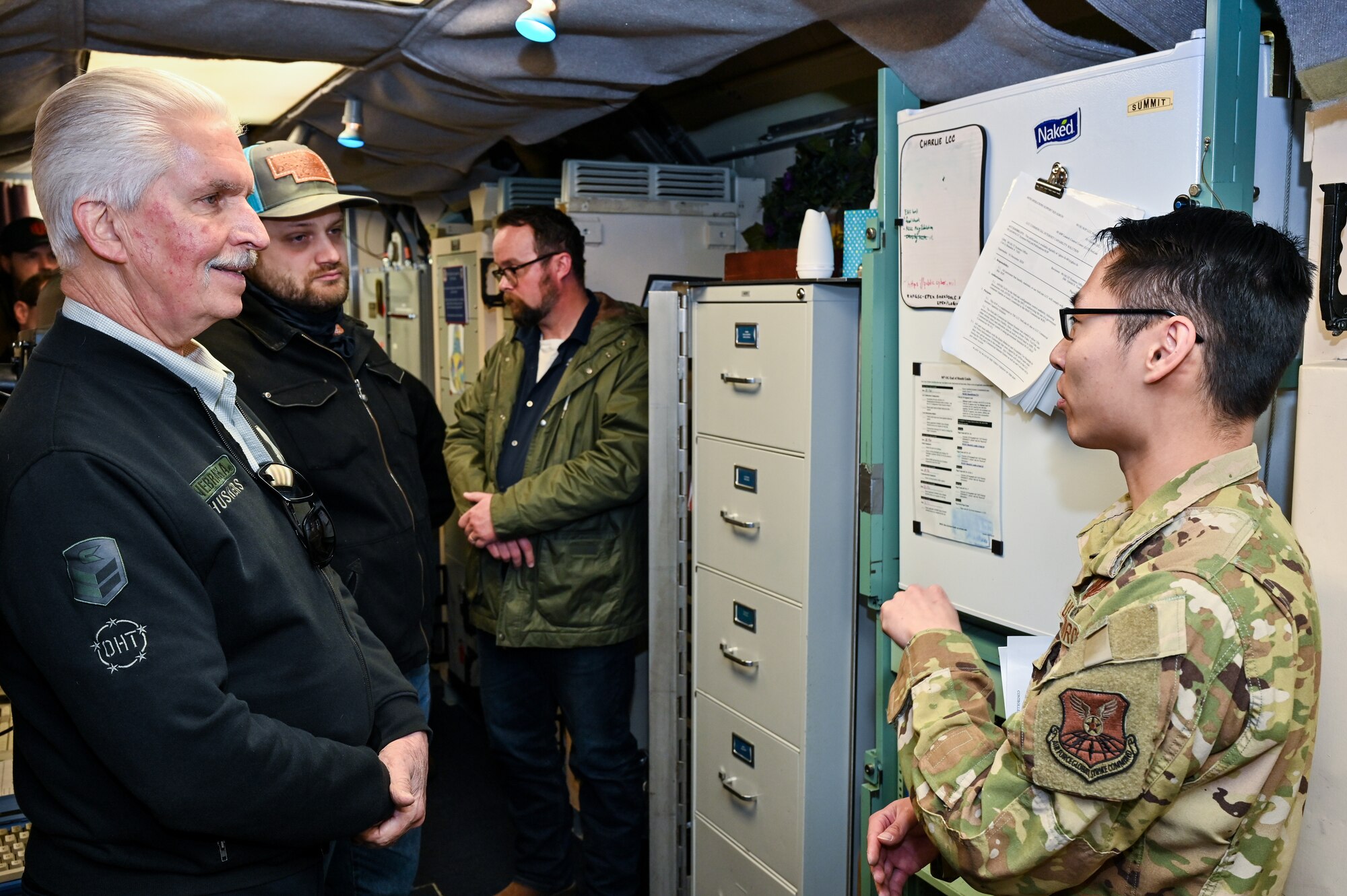 1st Lt. Sterling Pickett, 319th Missile Squadron missileer, briefs during a Nebraska Department of Economic Development team and Kimball and Sidney civic leader visit the C-01 missile alert facility near Harrisburg, Nebraska, March 22, 2023. 319 MS educated them on the safe, secure and reliable operation of the Minuteman III system.  (U.S. Air Force photo by Joseph Coslett Jr.)