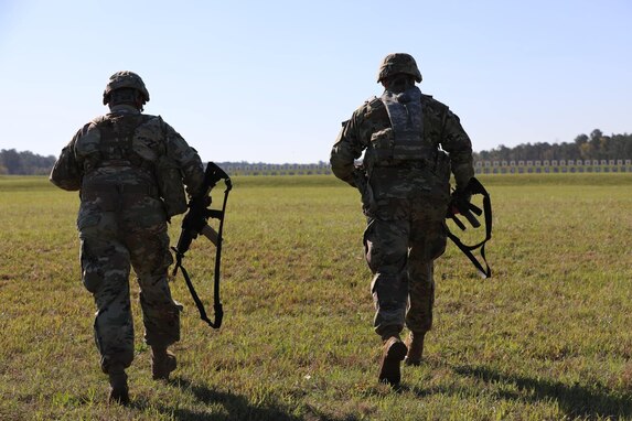 Soldiers from the 84th Training Command sprint 100 meters to their next firing position during the ALL-ARMY Small Arms Competition at Fort Benning, Ga.