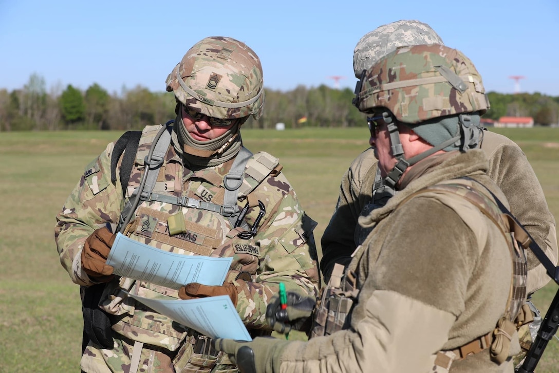Master Sgt. Joseph Thomas with the 84th Training Command takes note of his shot score card during a break between firing iterations at the ALL-ARMY Small Arms Competition at Fort Benning, Ga.