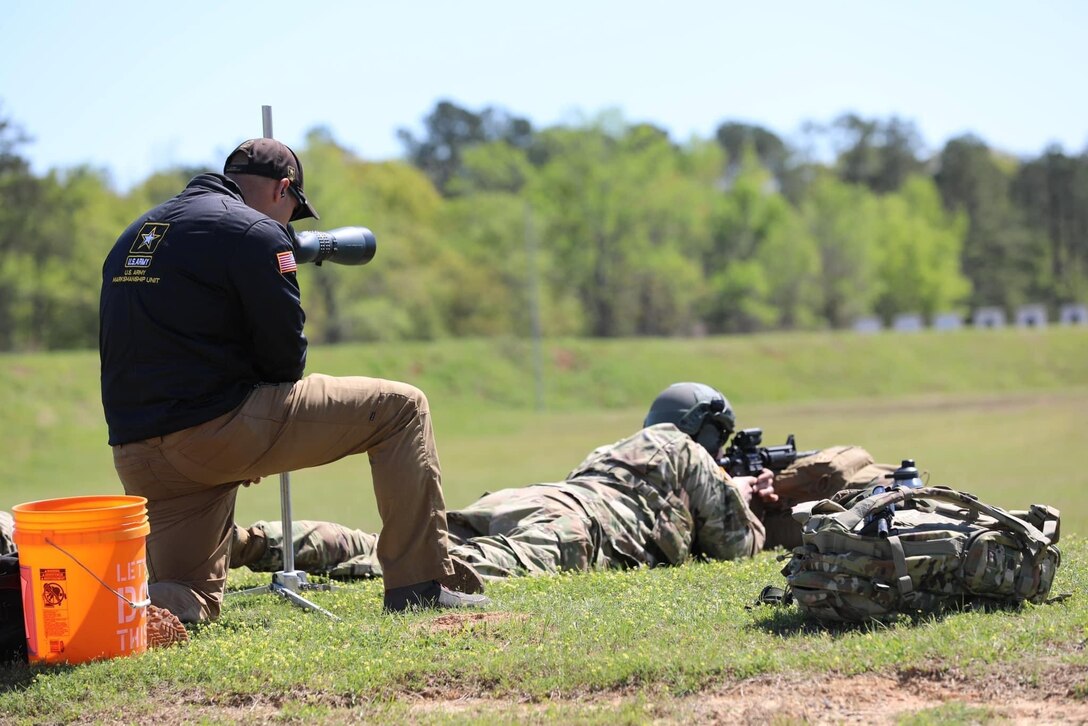 An ALL-ARMY shooting instructor surveys the range targets during a firing iteration at the ALL-ARMY Small Arms Competition at Fort Benning, Ga.