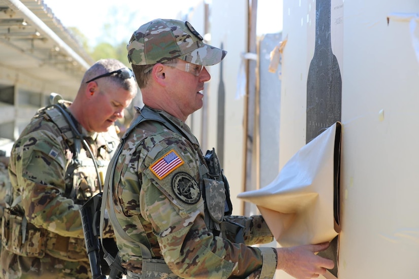 Sgt. 1st Class Justin Bovie prepares targets for firers at the ALL-ARMY Small Arms Competition at Fort Benning, Ga.