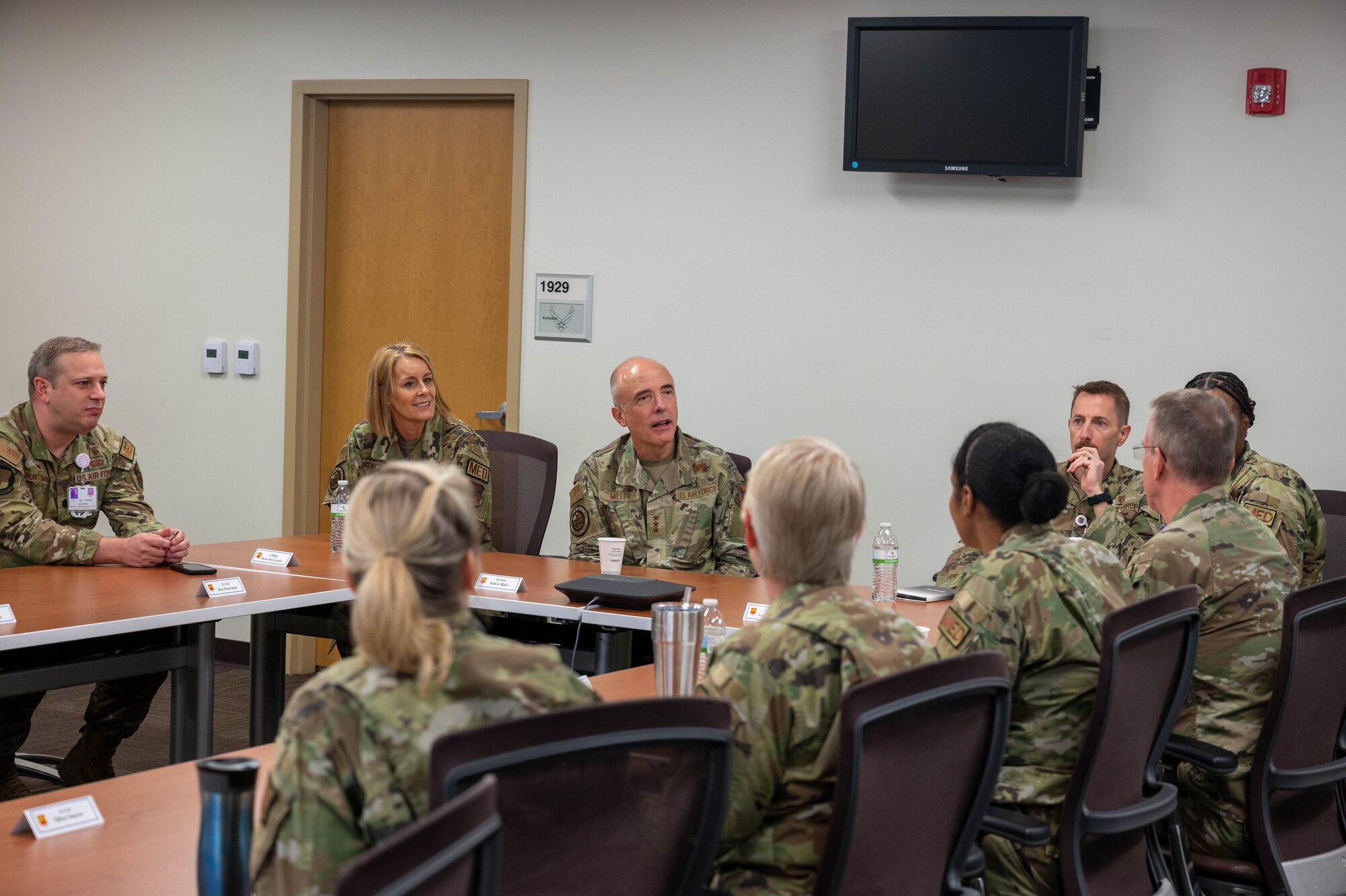 U.S. Air Force Lt. Gen. Robert Miller, Surgeon General of the Air Force, and Chief Master Sgt. Dawn Kolczynski, Medical Enlisted Force Chief, speaks with 56th Medical Group leadership during a mission brief, March 28, 2023, at Luke Air Force Base, Arizona.