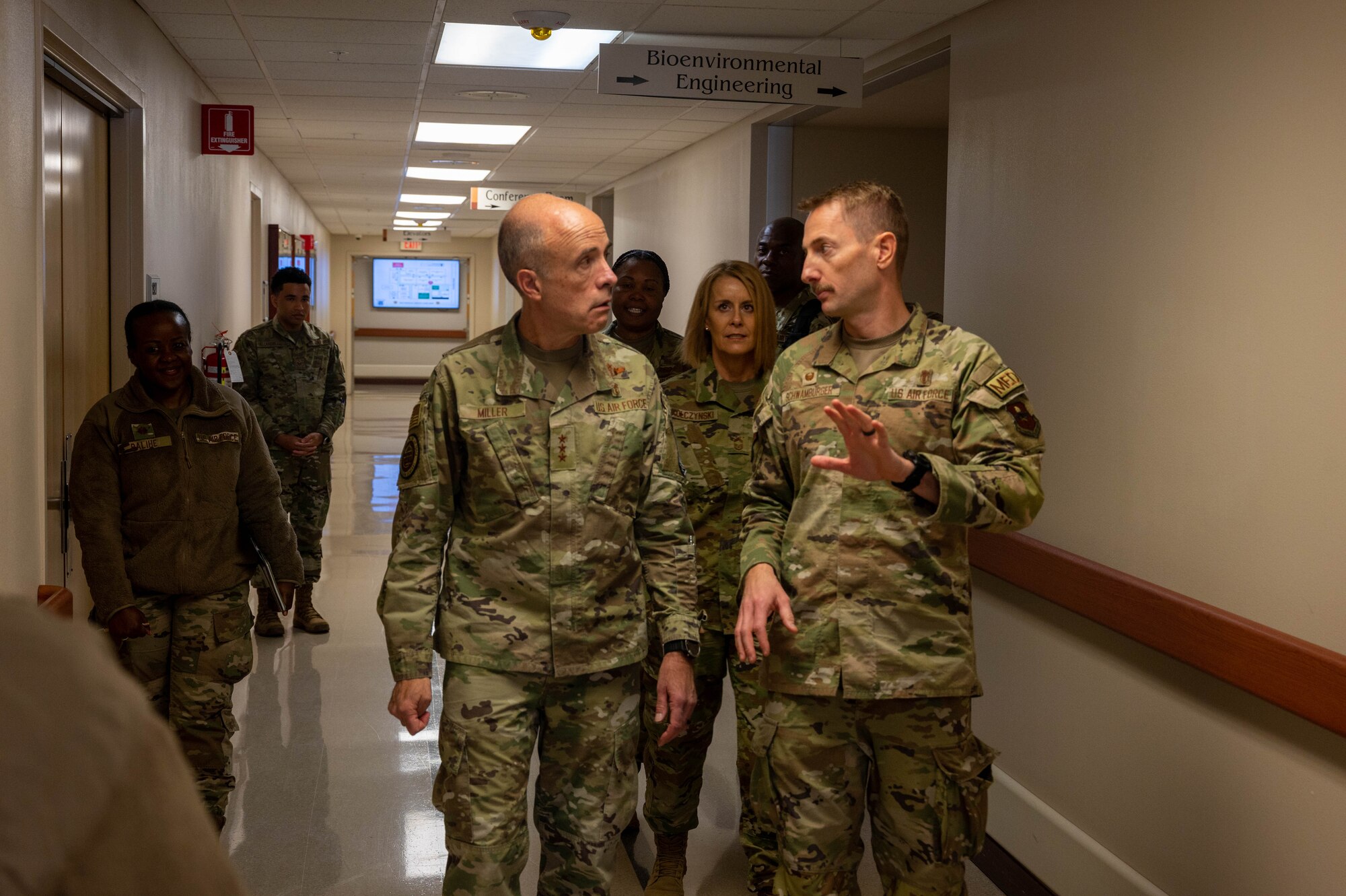U.S. Air Force Lt. Gen. Robert Miller, Surgeon General of the Air Force, speaks with Col. Nathan Schwarmburger, 56th Medical Group commander, during a base visit March 28, 2023, at Luke Air Force Base, Arizona.