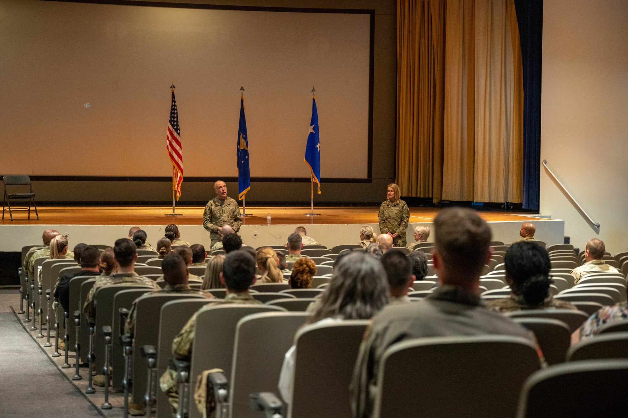 U.S. Air Force Lt. Gen. Robert Miller, Surgeon General of the Air Force, and Chief Master Sgt. Dawn Kolczynski, Medical Enlisted Force Chief, speaks with 56th Medical Group Airmen during an all-call, March 28, 2023, at Luke Air Force Base, Arizona.