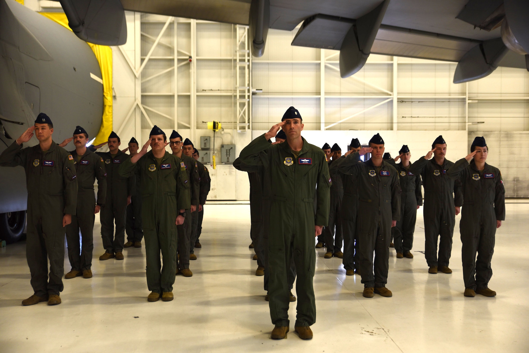 U.S. Air Force Airmen with the 4th Airlift Squadron give a final salute to U.S. Air Force Lt. Col. Ellen Canup, outgoing commander of the 4th AS, during a change of command ceremony at Joint Base Lewis-McChord, Washington, March 27, 2023. U.S. Air Force Lt. Col. Ellen Canup, outgoing commander of the 4th AS, relinquished command to Lt. Col. Timothy Ober. Aircrews from the 4th AS operate the C-17 Globemaster III aircraft, directly supporting numerous U.S. government agencies and international forces in global operations ranging from troop airlift/airdrop to lifesaving medevac and humanitarian/disaster relief. (U.S. Air Force photo by Airman Kylee Tyus)