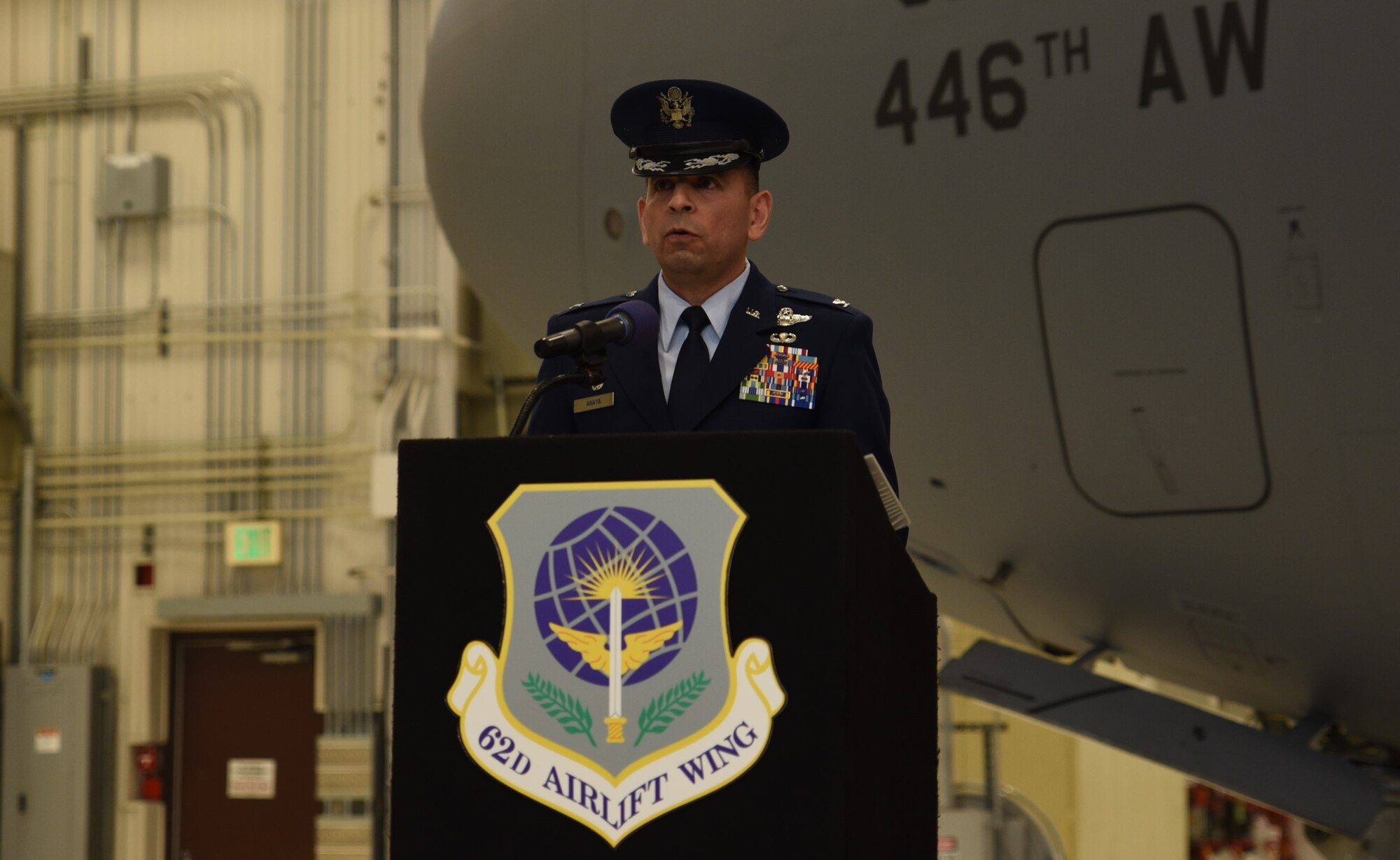 U.S. Air Force Col. Sergio Anaya, commander of the 62d Operations Group, gives remarks during the 4th Airlift Squadron change of command ceremony at Joint Base Lewis-McChord, Washington, March 27, 2023. Aircrews from the 4th AS operate the C-17 Globemaster III aircraft, directly supporting numerous U.S. government agencies and international forces in global operations ranging from troop airlift/airdrop to lifesaving medevac and humanitarian/disaster relief. (U.S. Air Force photo by Airman Kylee Tyus)