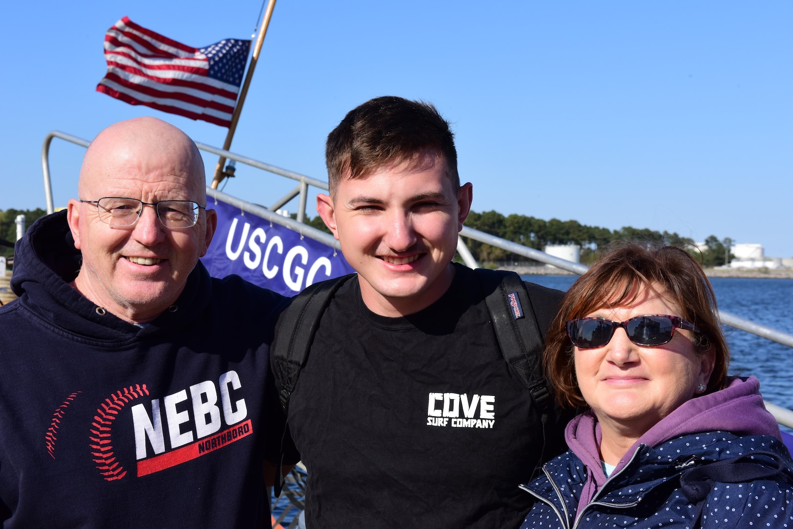 Petty Officer 2nd Class Robert Blanchette, a machinery technician assigned to USCGC Northland (WMEC 904), poses for a photo with family after the cutter returned home, March 30, 2023 in Portsmouth, Virginia. Northland conducted a 62-day maritime safety and security deployment in the Florida Straits and Windward Passage while patrolling in support of Homeland Security Task Force – Southeast and Operation Vigilant Sentry. (U.S. Coast Guard photo by Petty Officer 2nd Class Brandon Hillard)