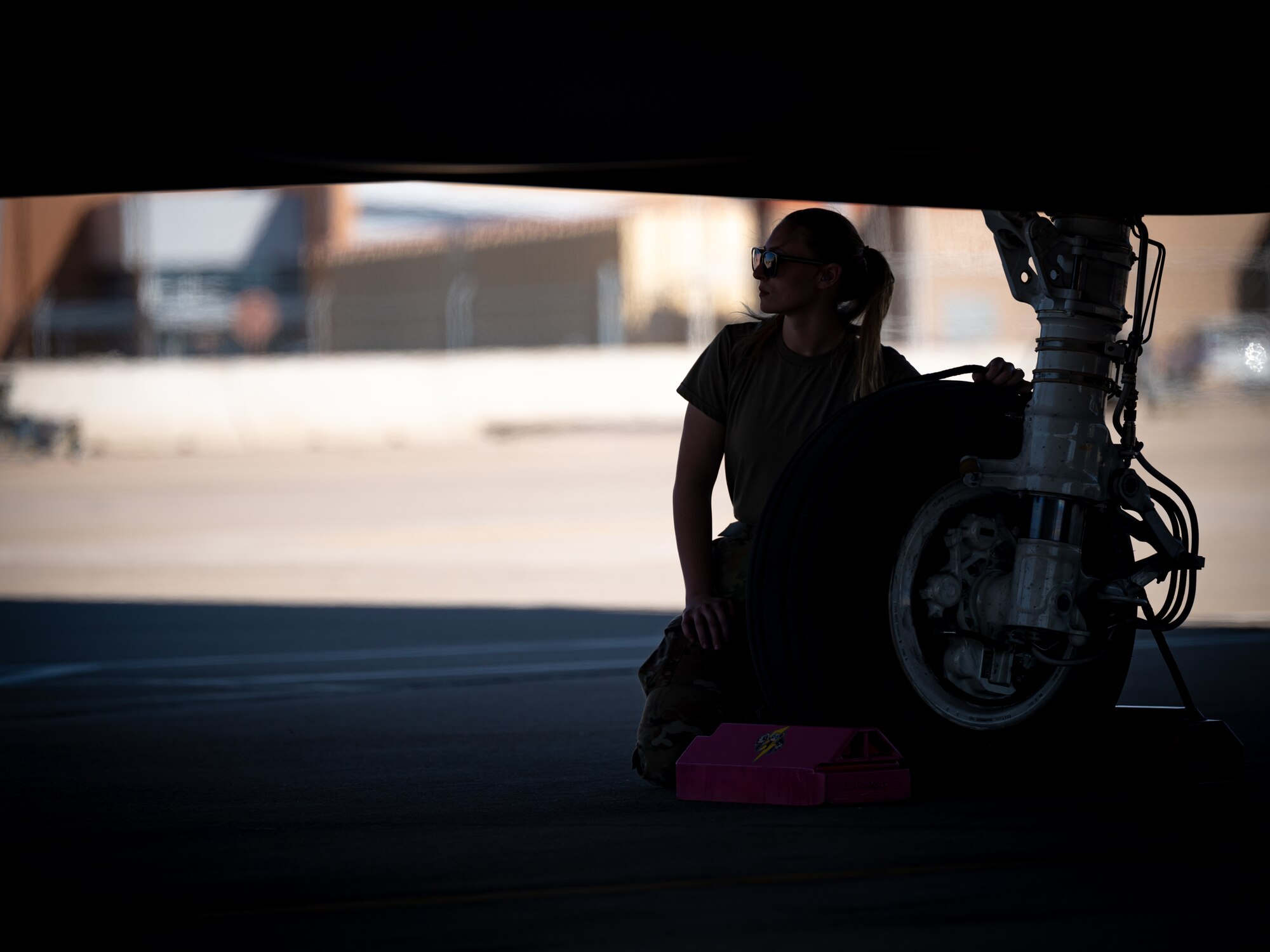 U.S. Air Force Airman Makenzie Milless, 62nd Fighter Squadron F-35 Lightning II crew chief, waits to pull wheel chocks before an F-35 sortie March 28, 2023, at Luke Air Force Base, Arizona.