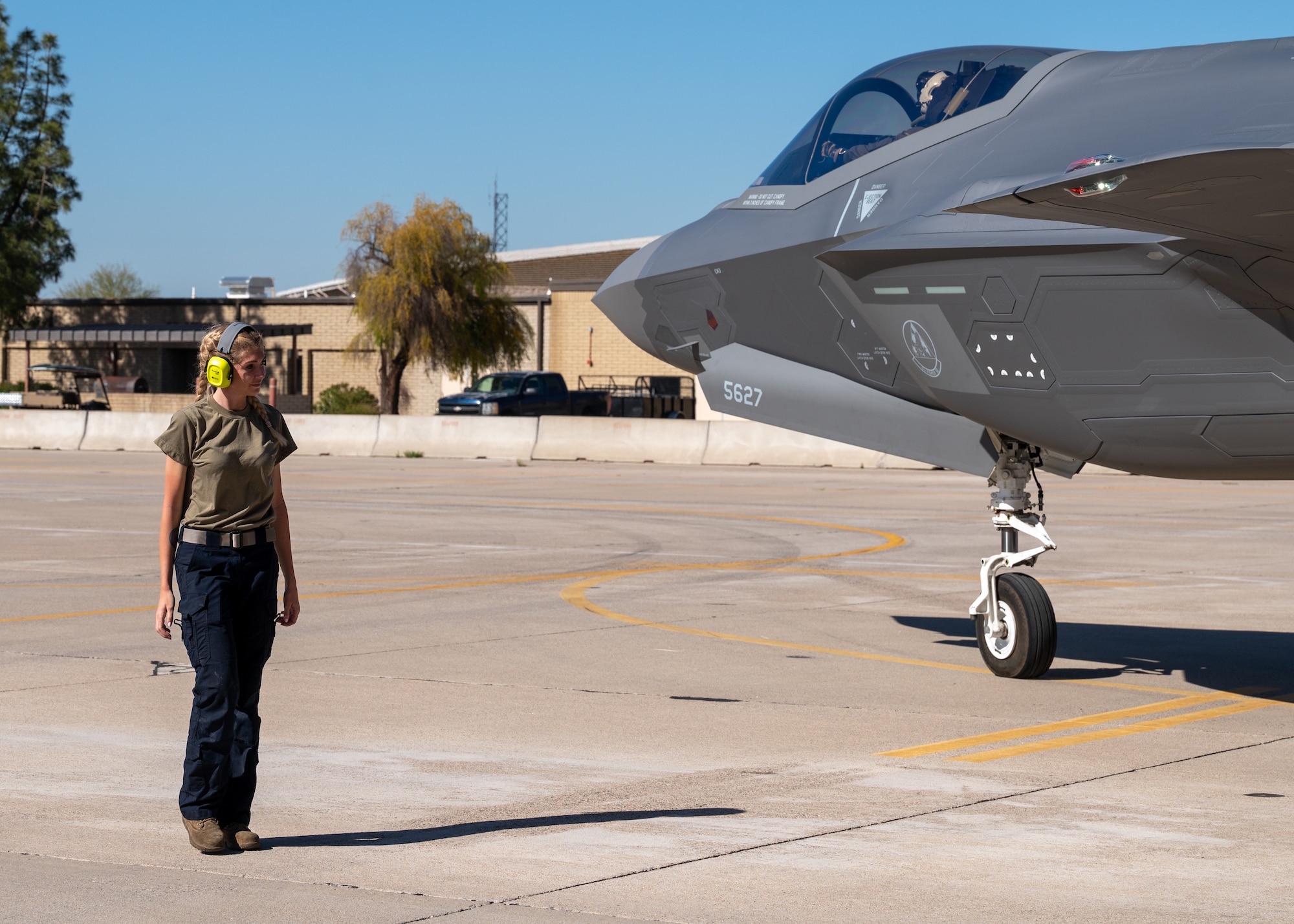 U.S. Air Force Staff Sgt. Paige Mitchell, 61st Fighter Squadron F-35 crew chief conducts a walk-around inspection of an F-35 at Luke Air Force Base, Arizona, Mar. 28, 2023.