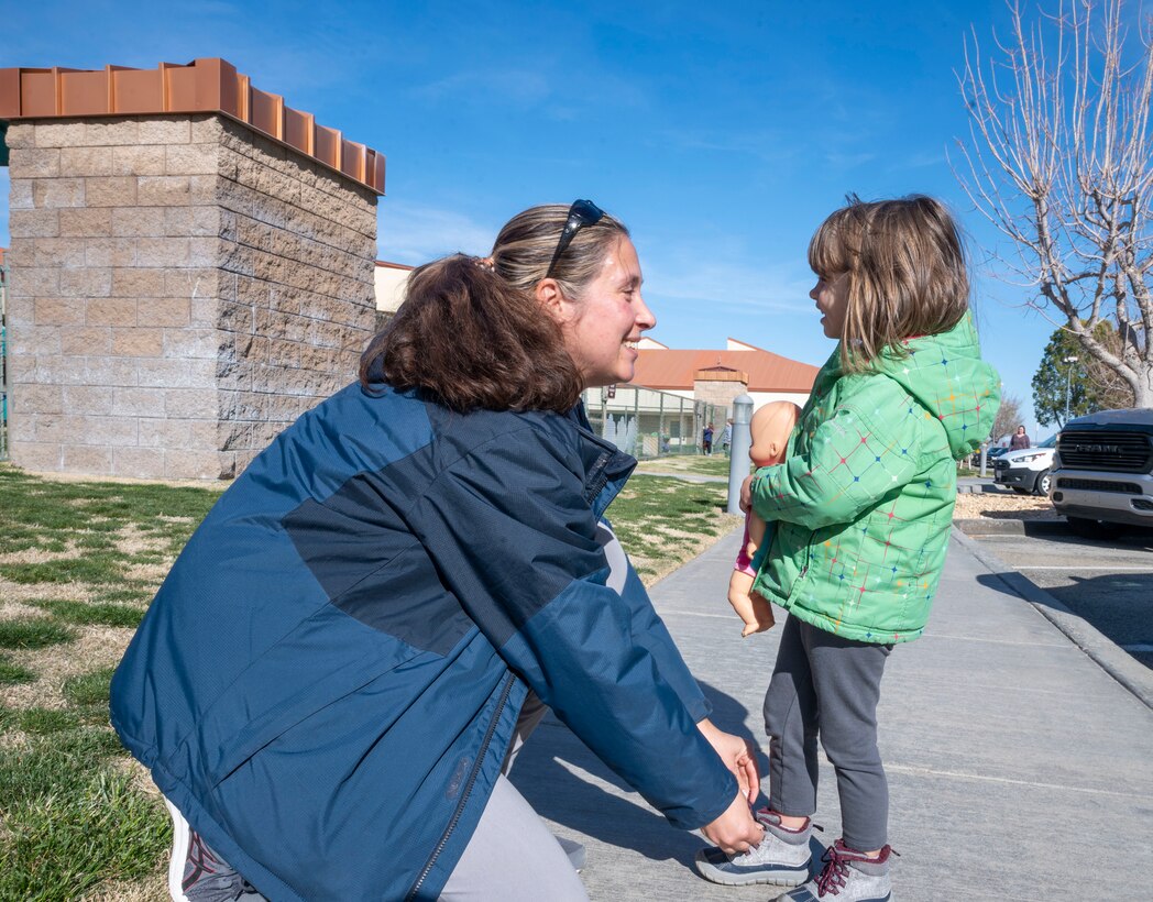 A mother makes sure her daughter’s shoe is tied as she drops her off at the Child Development Center. Quality childcare facilities and a wide variety of programs have distinguished the Edwards CDC as a flagship for childcare in Air Force Materiel Command. The Edwards CDC cares for children ages 6 weeks to 5 years, with a DOD-wide curriculum. The curriculum is focused on learning through play activities supporting social, emotional, physical and intellectual development.