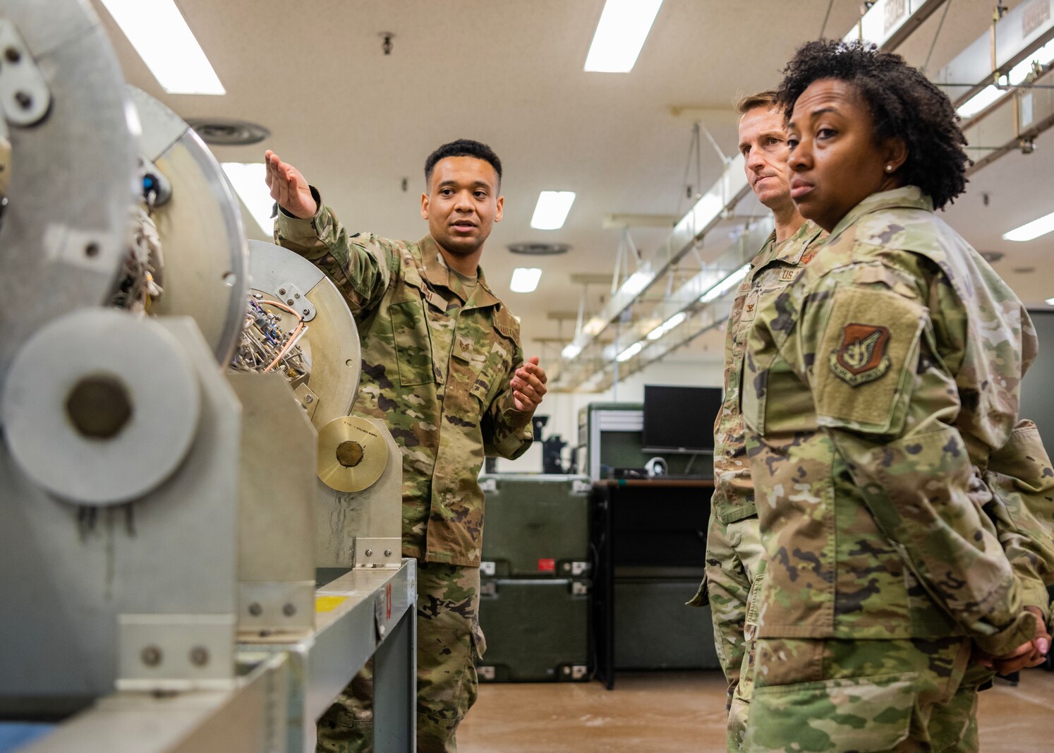 U.S. Air Force Staff Sgt. Lorenzo Finch, 35th Maintenance Squadron electronic warfare systems craftsman, explains aircraft systems to Col. Michael Richard, 35th Fighter Wing (FW) commander, and Command Chief Master Sgt. Cheronica Blandburg, 35th FW command chief, during a Wild Weasel Walk-through at Misawa Air Base, Japan, March 30, 2023. Electronic warfare systems specialists go through extensive training to be able to install and service radar, communications, weapons and other flight operations to ensure the safety of the aircraft and the crew and the successful completion of missions. (U.S. Air Force photo by Tech. Sgt. Jao’Torey Johnson)