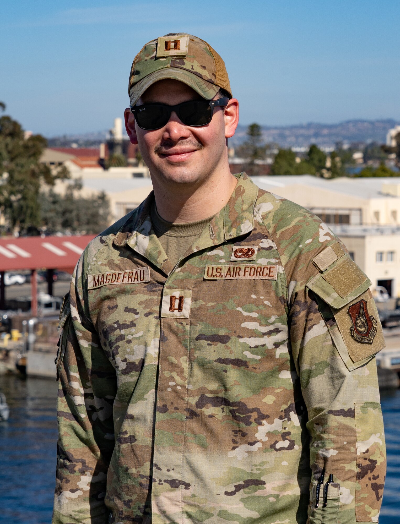 Capt. Jackson Magdefrau, 374th Aircraft Maintenance Squadron aircraft maintenance officer in charge, poses for a photo on the flight deck of the USS Carl Vinson (CVN 70) at Naval Air Station North Island, San Diego, March 9th, 2023. Magdefrau was awarded the Maj. Gen. Saunders Chapter Distinguished Service Award for exemplifying superior leadership in service to the Logistics Officer Association. (U.S. Air Force photo by Airman 1st Class Trevor Bell)