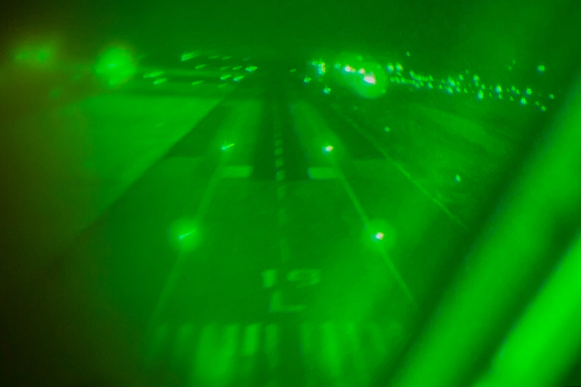 A KC-46A Pegasus approaches the landing box at McConnell Air Force Base, Kansas, March 29, 2023, during Exercise Lethal Pride. The aircrew performed the first training on the newly installed Airfield Marking Patterns (AMP)-3 system at McConnell. AMP-3 is a specific type of airfield marking pattern that is used for unconventional airfields and landing zones that lack traditional airfield lighting. (U.S. Air Force photo by Airman 1st Class Brenden Beezley)