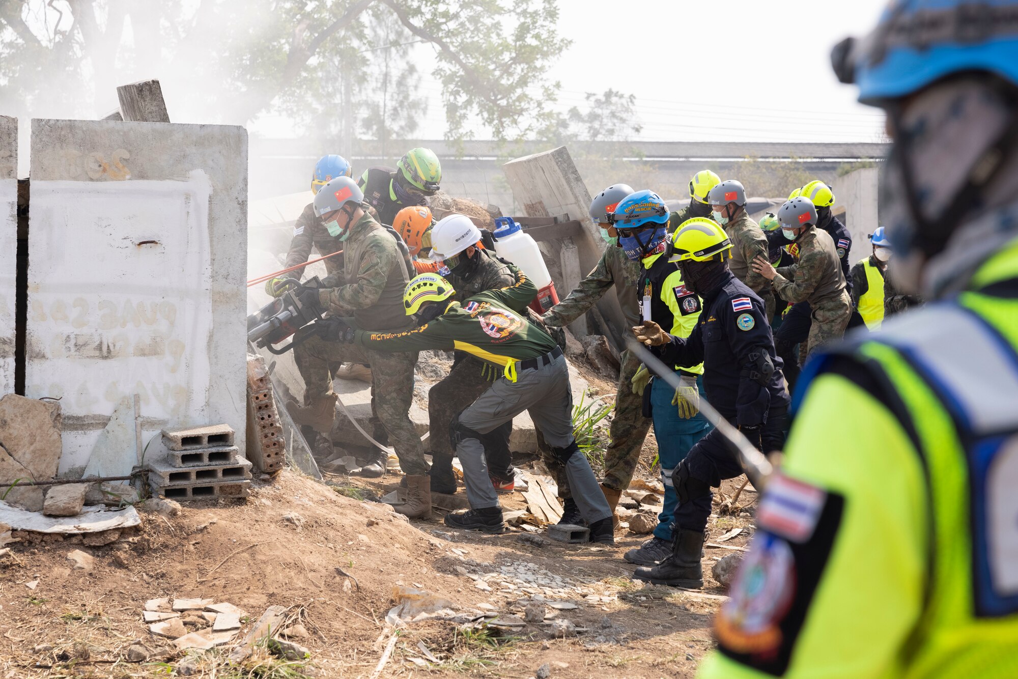 Service members from participating nations and members of the Humanitarian Assistance Disaster Relief Institute demonstrate a collapsed building rescue during Exercise Cobra Gold 2023 at the Disaster Relief Training Center in Chachoengsao province, Kingdom of Thailand, March 4, 2023. At the demonstration leaders from participating nations discussed how their nations can combine capabilities in response to regional crises.