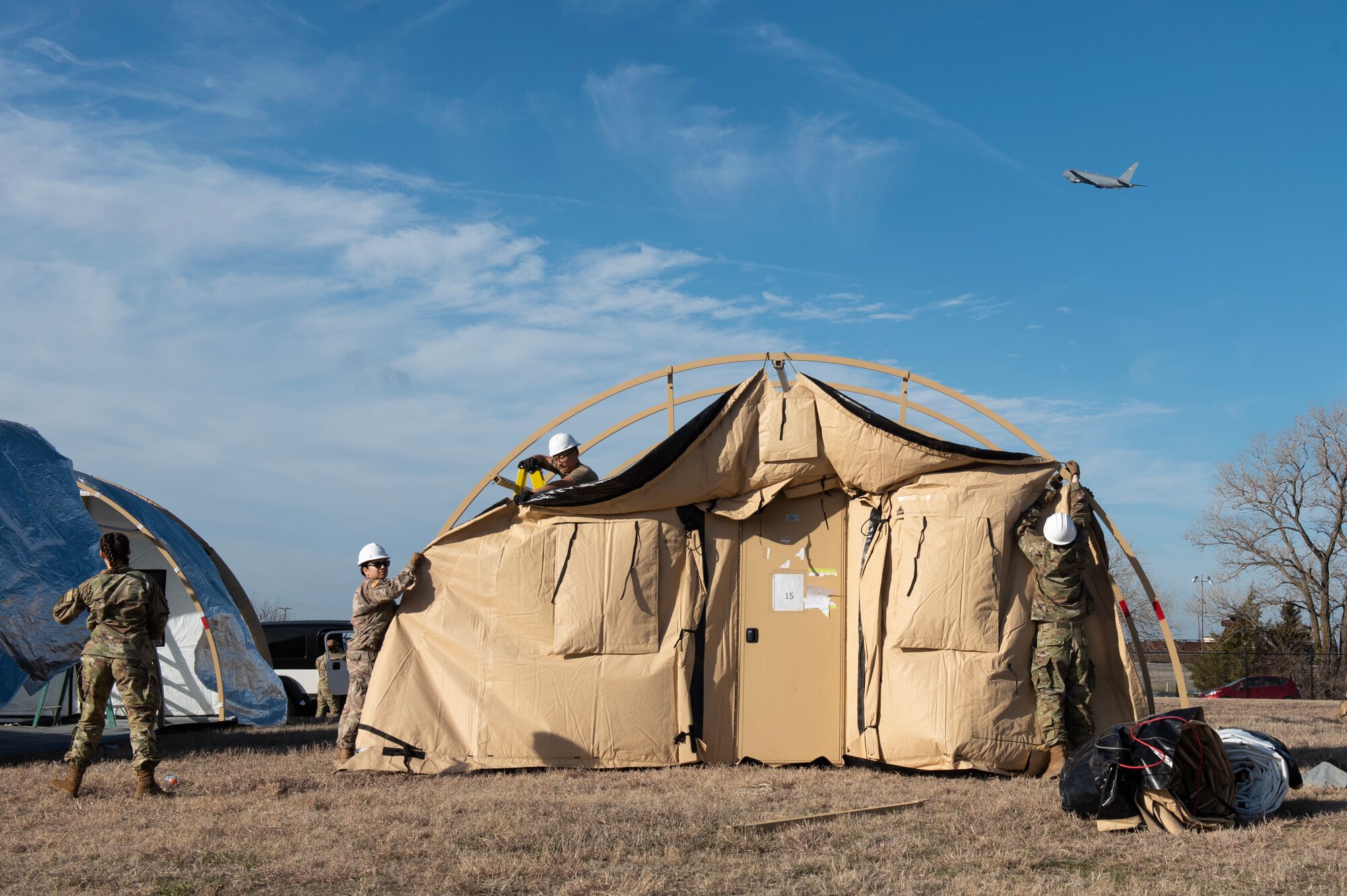 Airmen from the 22nd Civil Engineer Squadron set up a tent in preparation for Exercise Lethal Pride at McConnell Air Force Base, Kansas, March 22, 2023. Lethal Pride is a week-long exercise to test McConnell’s capabilities and readiness. (U.S. Air Force photo by Staff Sgt. Tryphena Mayhugh)