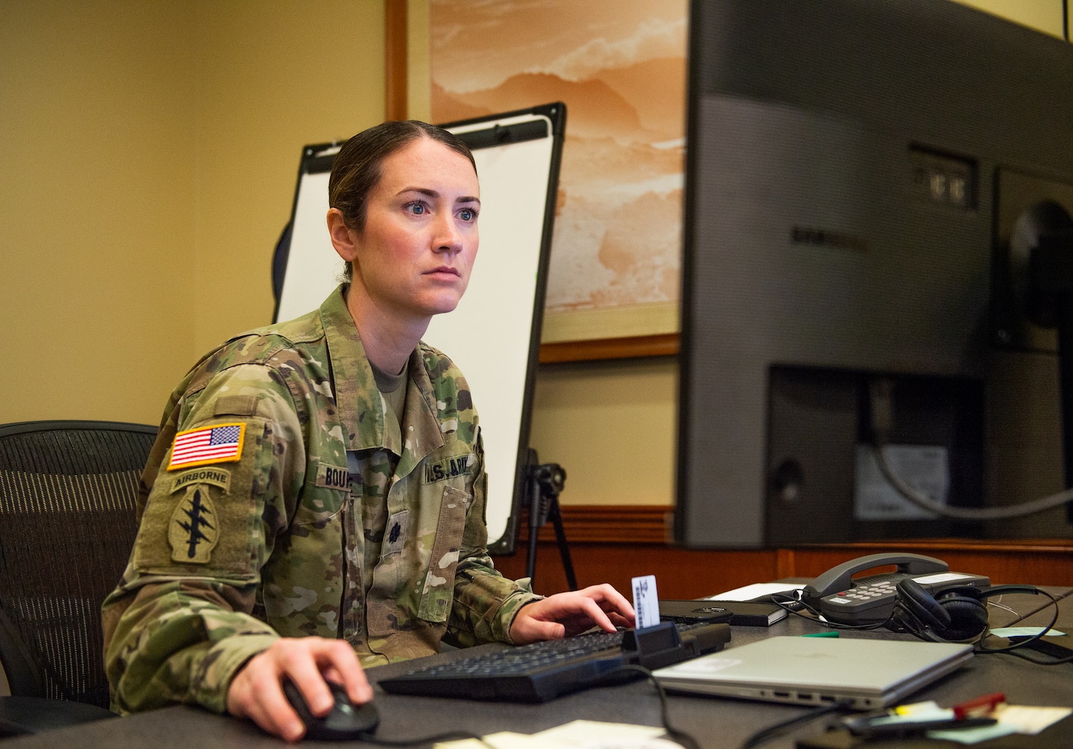 U.S. Army Lt. Col. Jill Bourque, Deputy Chief of Staff of Joint Task Force-Red Hill (JTF-RH), works on her computer on Ford Island, Hawaii March 21, 2023. JTF-RH is in phase three of its five-phase defueling plan. Personnel are focused on completing repairs, quality control tasks, training, response preparation, the National Environmental Policy Act (NEPA) Environmental Assessment (EA), regulatory approvals and operational planning for such things as dewatering, repacking, and defueling. This extensive preparatory work will help ensure the safe and expeditious defueling of the RHBFSF. (U.S. Navy photo by Mass Communication Specialist 2nd Class Allayah Klein)