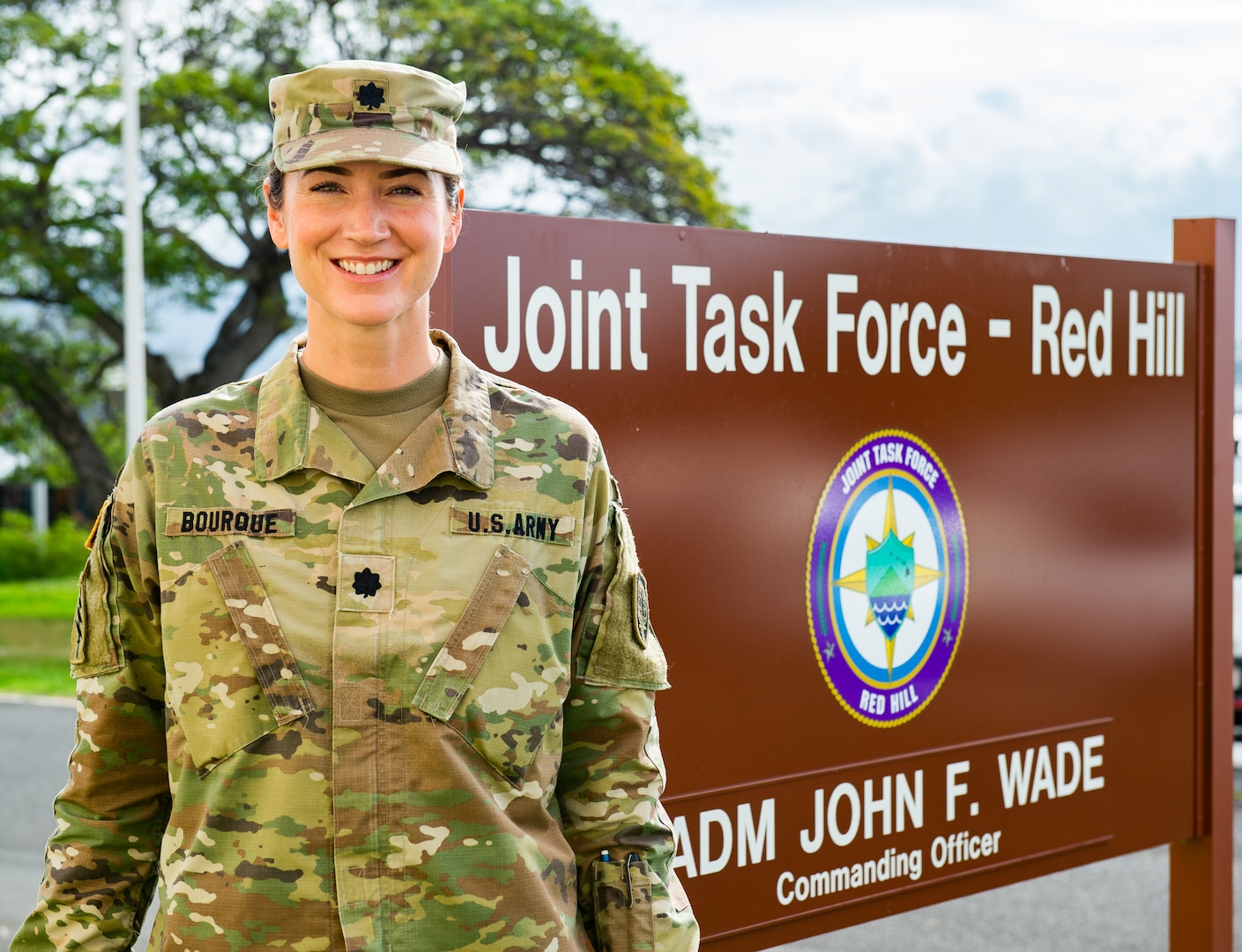 U.S. Army Lt. Col. Jill Bourque, Deputy Chief of Staff of Joint Task Force-Red Hill (JTF-RH), poses in front of the JTF-RH Headquarters on Ford Island, Hawaii March 21, 2023. JTF-RH is in phase three of its five-phase defueling plan. Personnel are focused on completing repairs, quality control tasks, training, response preparation, the National Environmental Policy Act (NEPA) Environmental Assessment (EA), regulatory approvals and operational planning for such things as dewatering, repacking, and defueling. This extensive preparatory work will help ensure the safe and expeditious defueling of the RHBFSF. (U.S. Navy photo by Mass Communication Specialist 2nd Class Allayah Klein)