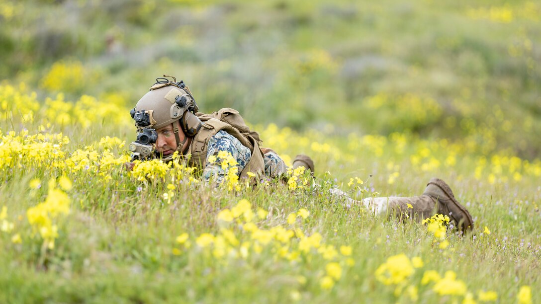 A U.S. Marine with 2nd Battalion, 1st Marine Regiment, 1st Marine Division, provides security during a hasty exfiltration as part of a small boat raid course hosted by Expeditionary Operations Training Group, I Marine Expeditionary Force, at Marine Corps Base Camp Pendleton, California, March 16, 2023. The EOTG small boat raid course enhances Marines' tactics, techniques, and procedures in expeditious amphibious raid operations in preparation for future deployments.