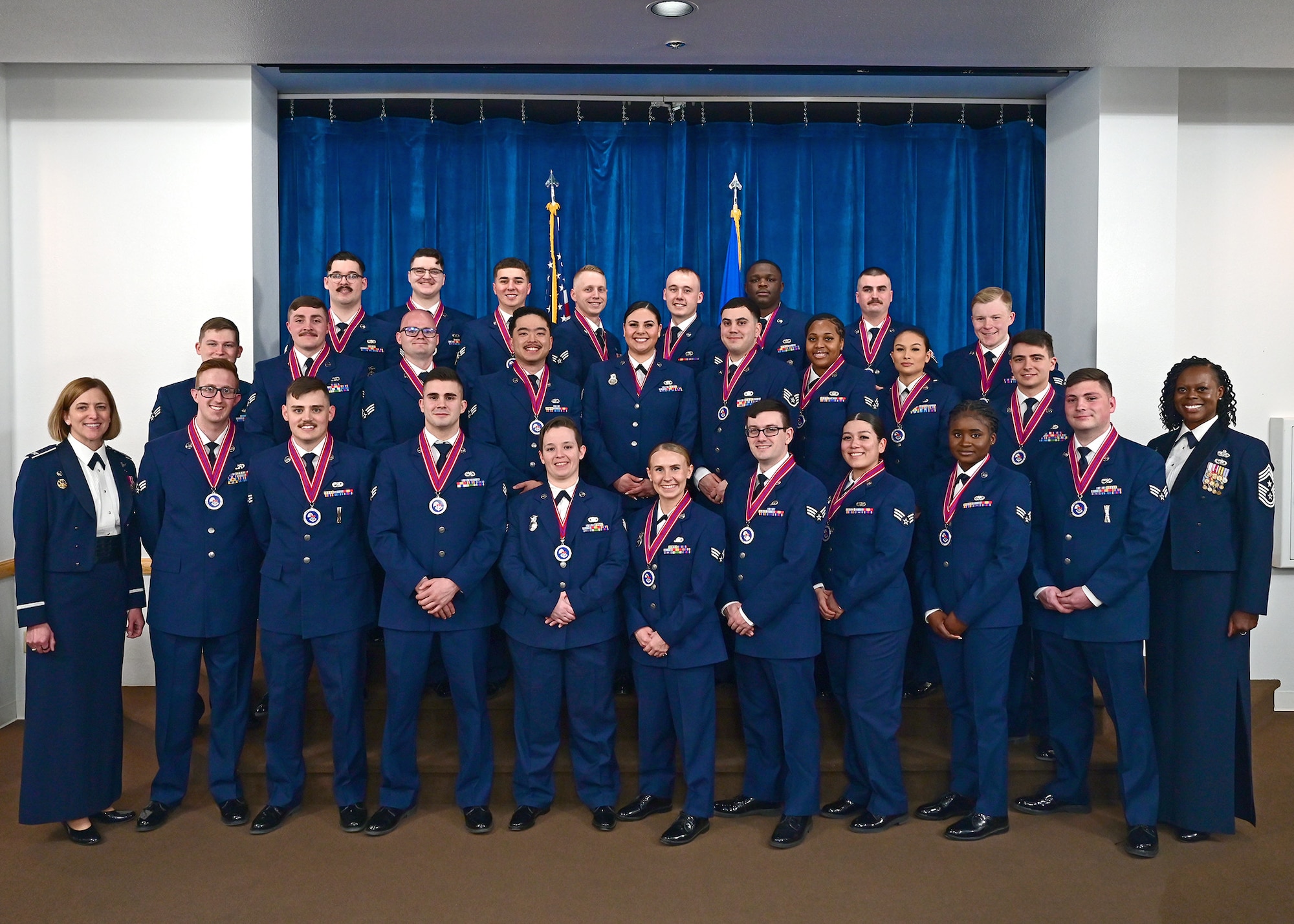 posed group photo of ALS graduates in their mess dress blue uniforms.