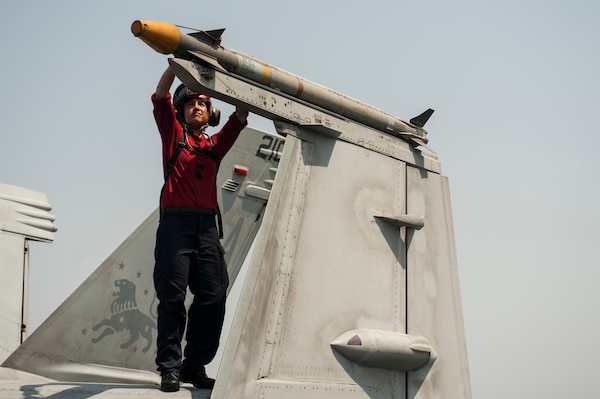 Aviation Ordnanceman 2nd Class Nicole Jordan, from Livermore Falls, Maine, inspects an AIM 9X missile on an F/A-18F Super Hornet from the Fighting Black Lions of Strike Fighter Squadron (VFA) 213 on the flight deck of the aircraft carrier USS George H.W. Bush (CVN 77). George H.W. Bush is supporting maritime security operations and theater security cooperation efforts in the U.S. 5th Fleet area of responsibility.  (U.S. Navy photo by Mass Communication Specialist 3rd Class Brian Stephens/Released)