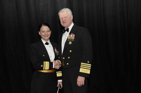 U.S. Navy Adm. Gary Roughead, right, Chief of Naval Operations, poses for a photo with Rear Adm. Wendi B. Carpenter, commander of Navy Warfare Development Command, at the 2011 Scholarship Awards Banquet and Women in Aviation International (WAI) Pioneer Hall of Fame Induction Ceremony during the 22nd Annual WAI Conference in Reno, Nev., Feb. 26, 2011. (U.S. Navy photo by Chief Mass Communication Specialist Tiffini Jones Vanderwyst/Released)