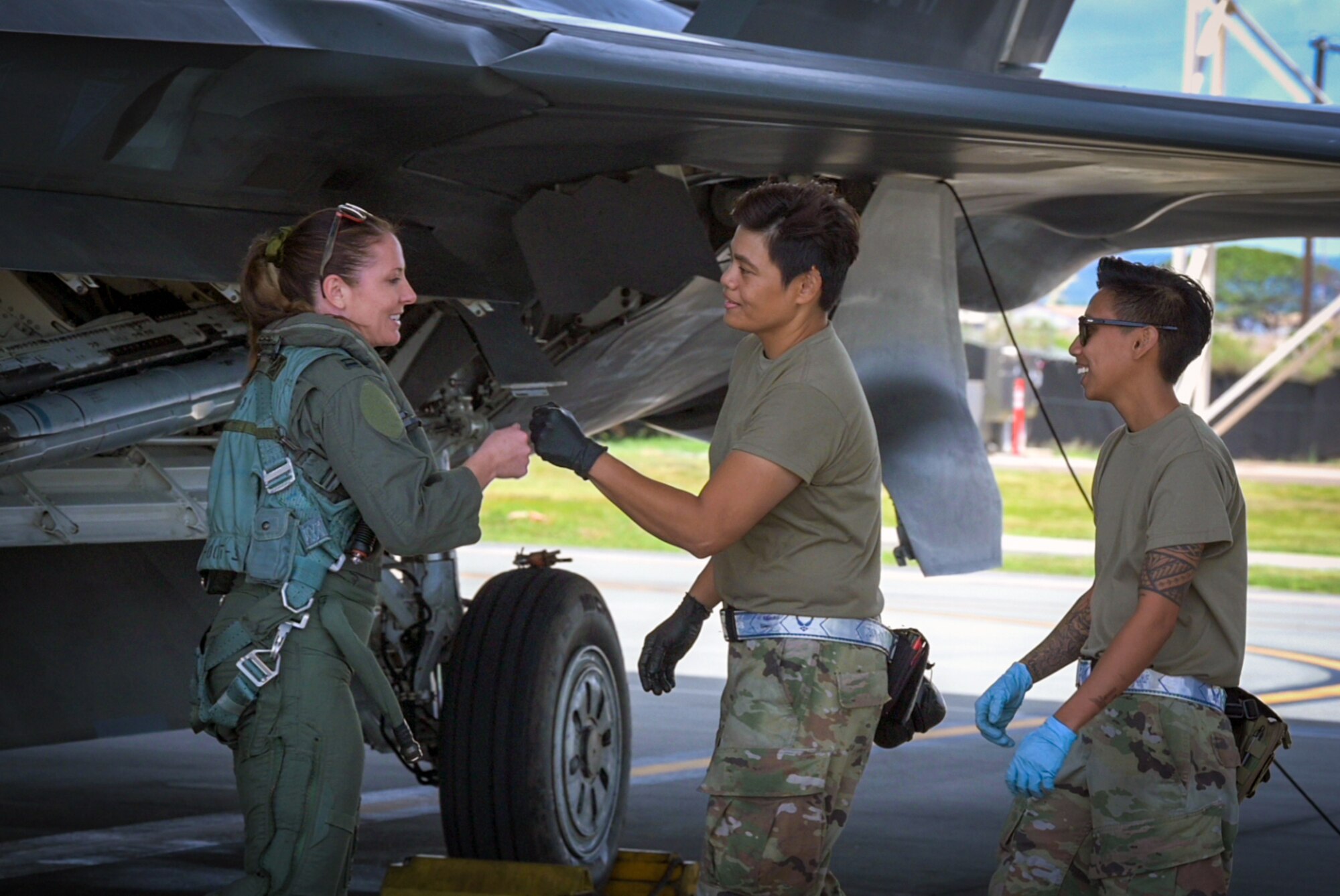 U.S. Air Force Capt. Nichole Bahlman, 199th Fighter Squadron F-22 Raptor pilot, is greeted by her female crew chiefs prior to take-off during a routine training mission Joint Base Pearl Harbor-Hickam, Hawaii, Mar 16, 2023. Capt. Bahlman is the first female fighter pilot in the Hawaii Air National Guard. (U.S. Air National Guard photo by Master Sgt. Mysti Bicoy)