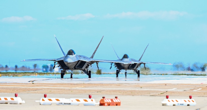 The first two F-22 Raptors, part of the incoming Formal Training Unit aircraft fleet, touch down at Joint Base Langley-Eustis