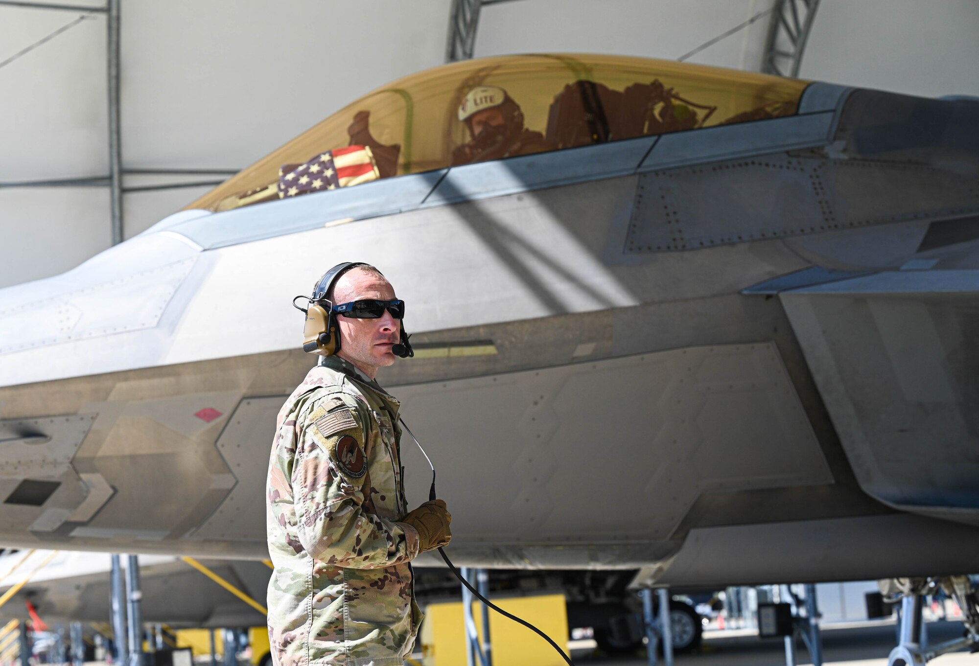 Crew chief awaits to communicate to the pilot