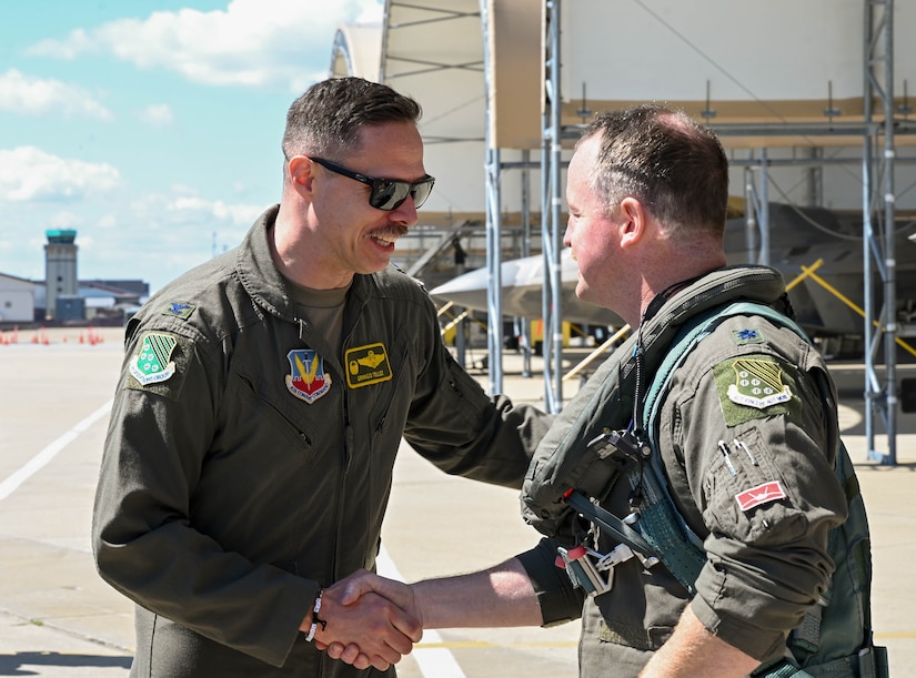 Col. Tellez greets Lt. Col. Evers