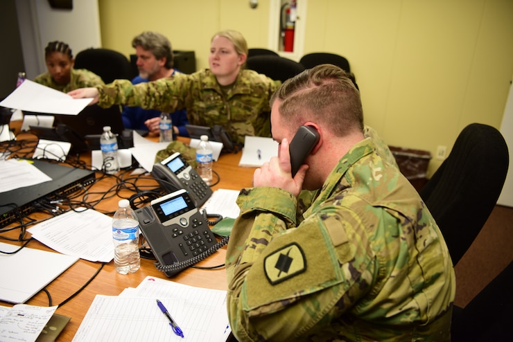 A Soldier answers a phone.