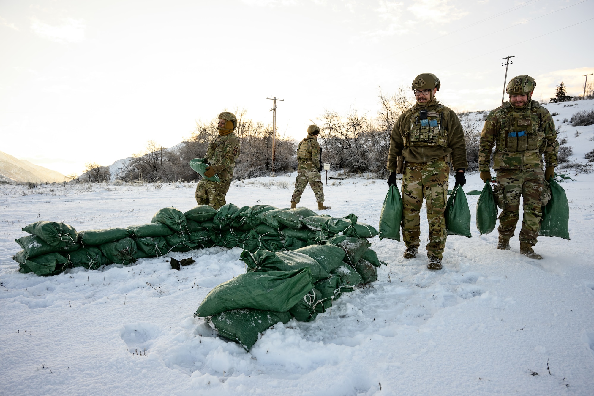 Defenders with the 75th Security Forces Squadron build a fighting position during a training exercise at Hill Air Force Base, Utah, March 21, 2023. The squadron conducted a series of near-peer adversary field training exercises in the Base Operations Readiness Area from March 18-28. (U.S. Air Force photo by R. Nial Bradshaw)
