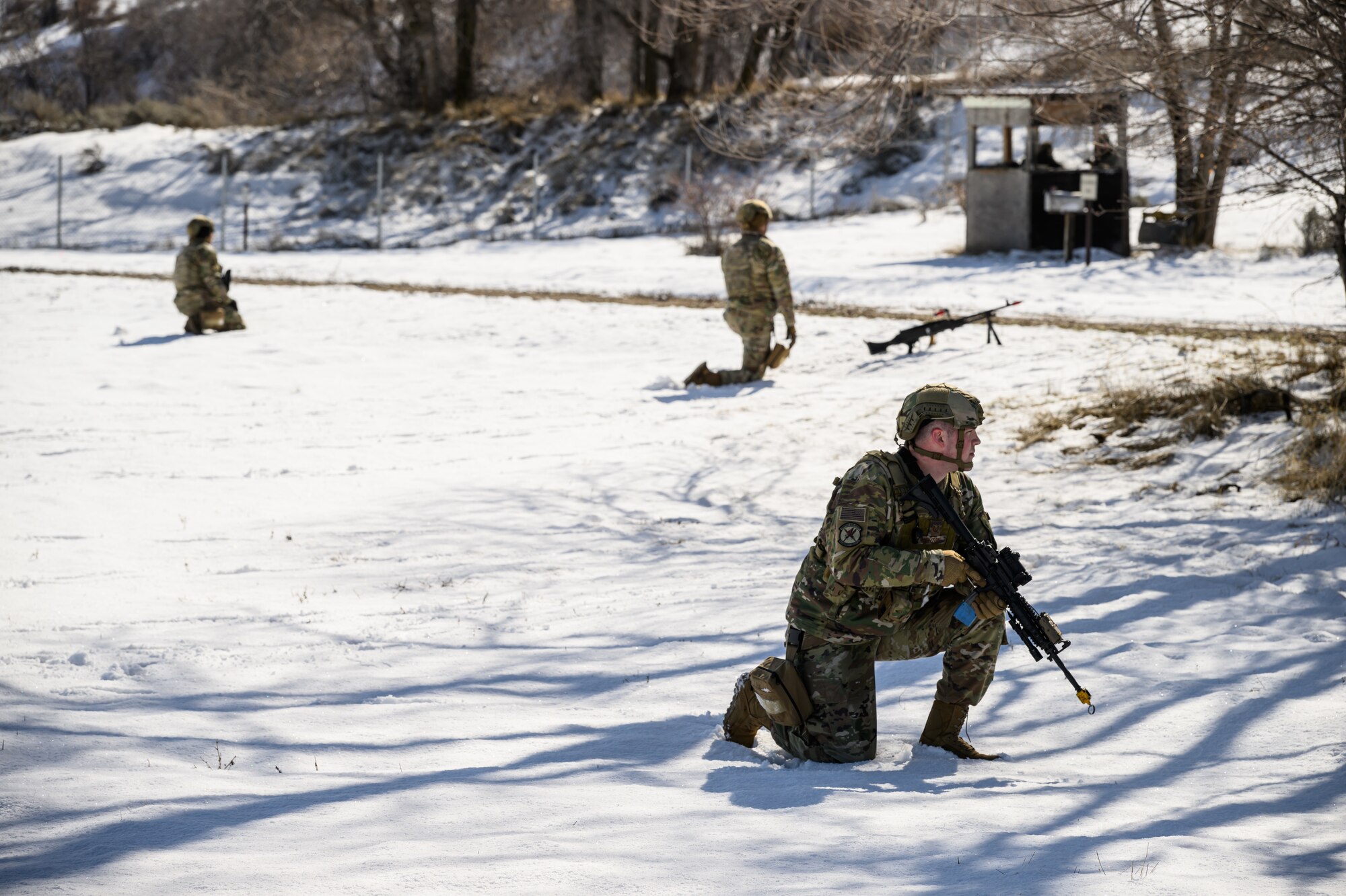 Defenders with the 75th Security Forces Squadron establish security around a communication site during a training exercise at Hill Air Force Base, Utah, March 21, 2023. The squadron conducted a series of near-peer adversary field training exercises in the Base Operations Readiness Area from March 18-28. (U.S. Air Force photo by R. Nial Bradshaw)