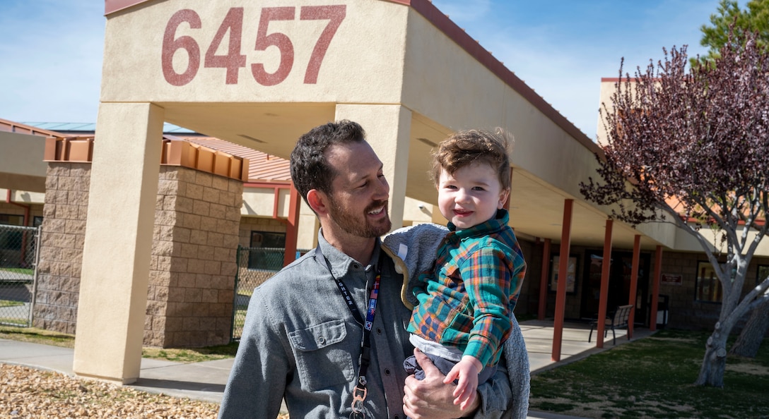 Jason Frick, 412th Range Squadron picks up his son at the child development center. The Edwards CDC provides activities and programs which support children’s social, emotional, physical and intellectual development.