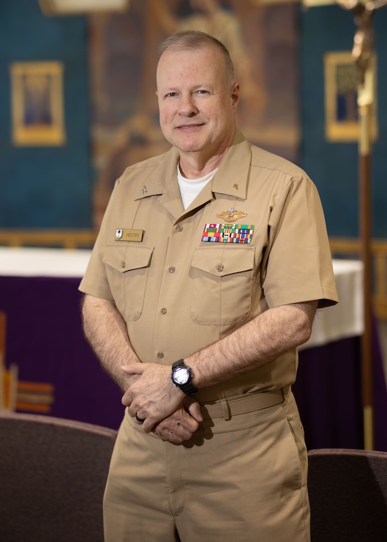 U.S. Navy Capt. Chris Hester, Pastoral Care Department Chief, poses for a photo inside the Chapel of Hope.