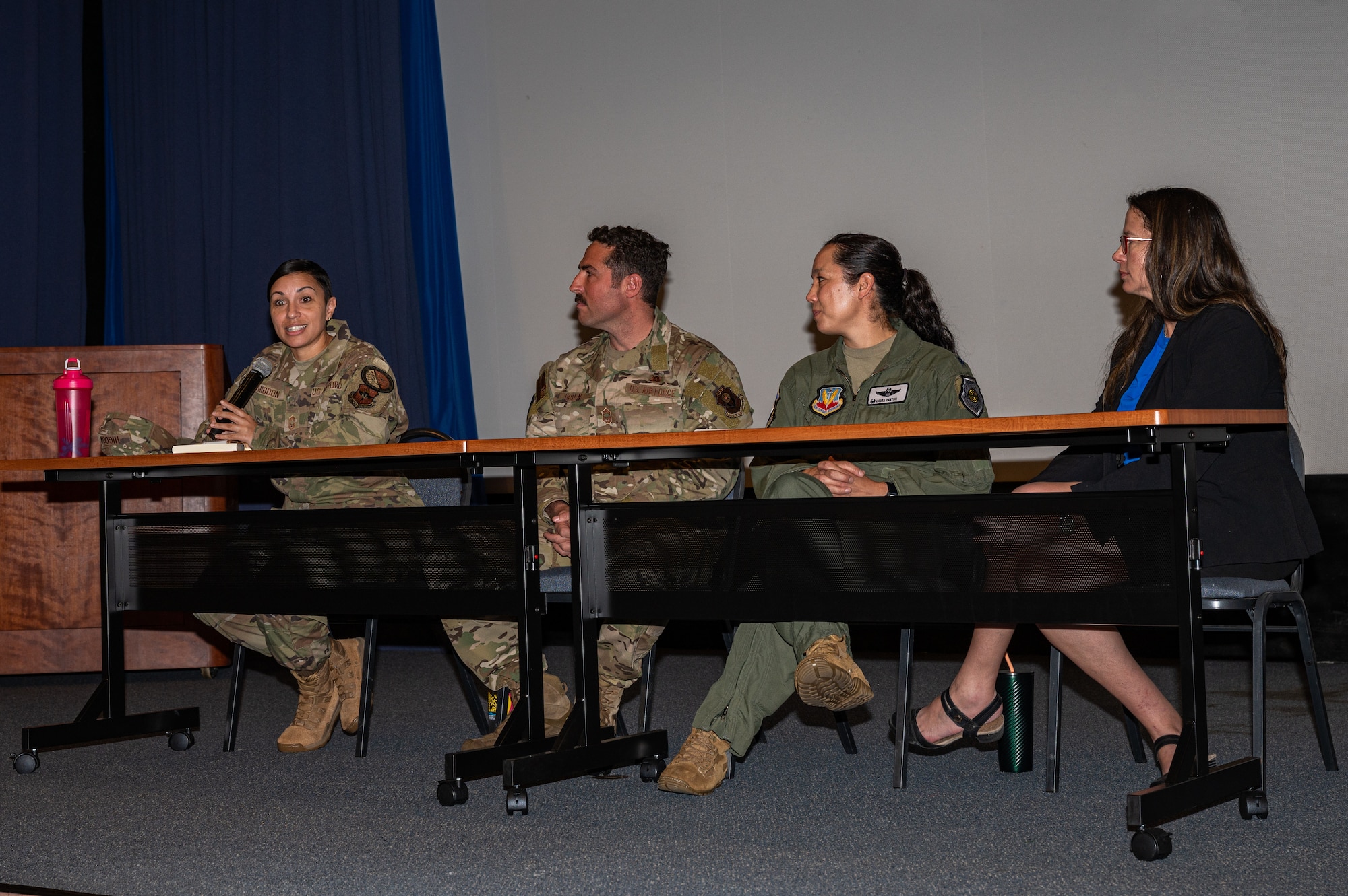 U.S. Military members sit at a table during a womens history month panel
