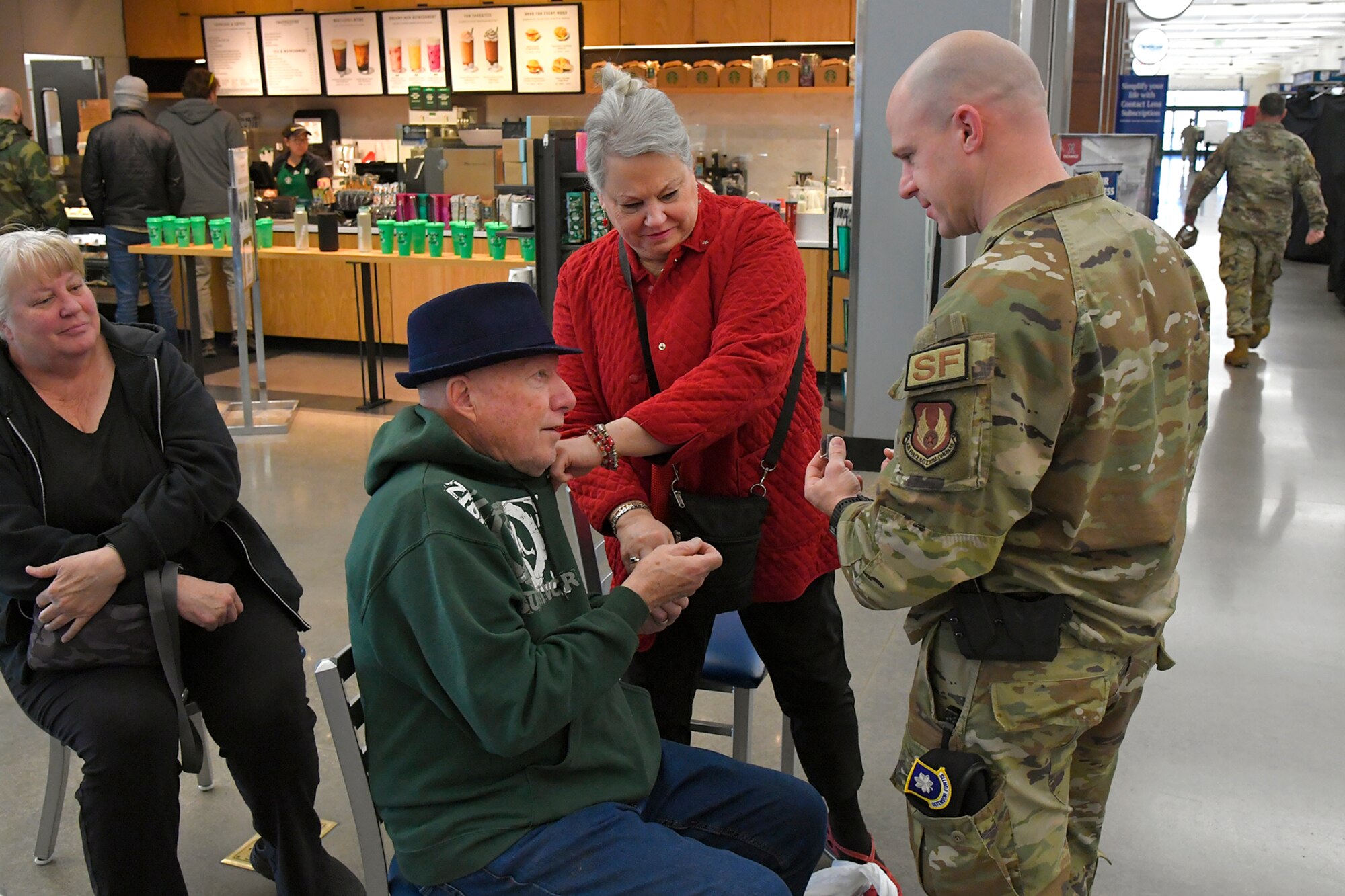 (Left to right) Doug Hammond, a Vietnam veteran who served in the Air Force for 21 years, receives a commemorative lapel pin from Lt. Col. Paul Dinkins, 75th Security Forces Squadron commander, during a pinning ceremony March 29, 2023, at the AAFES Base Exchange at Hill Air Force Base, Utah. The ceremony was held to honor and remember Vietnam era veterans for National Vietnam Veterans Day. (U.S. Air Force photo by Todd Cromar)
