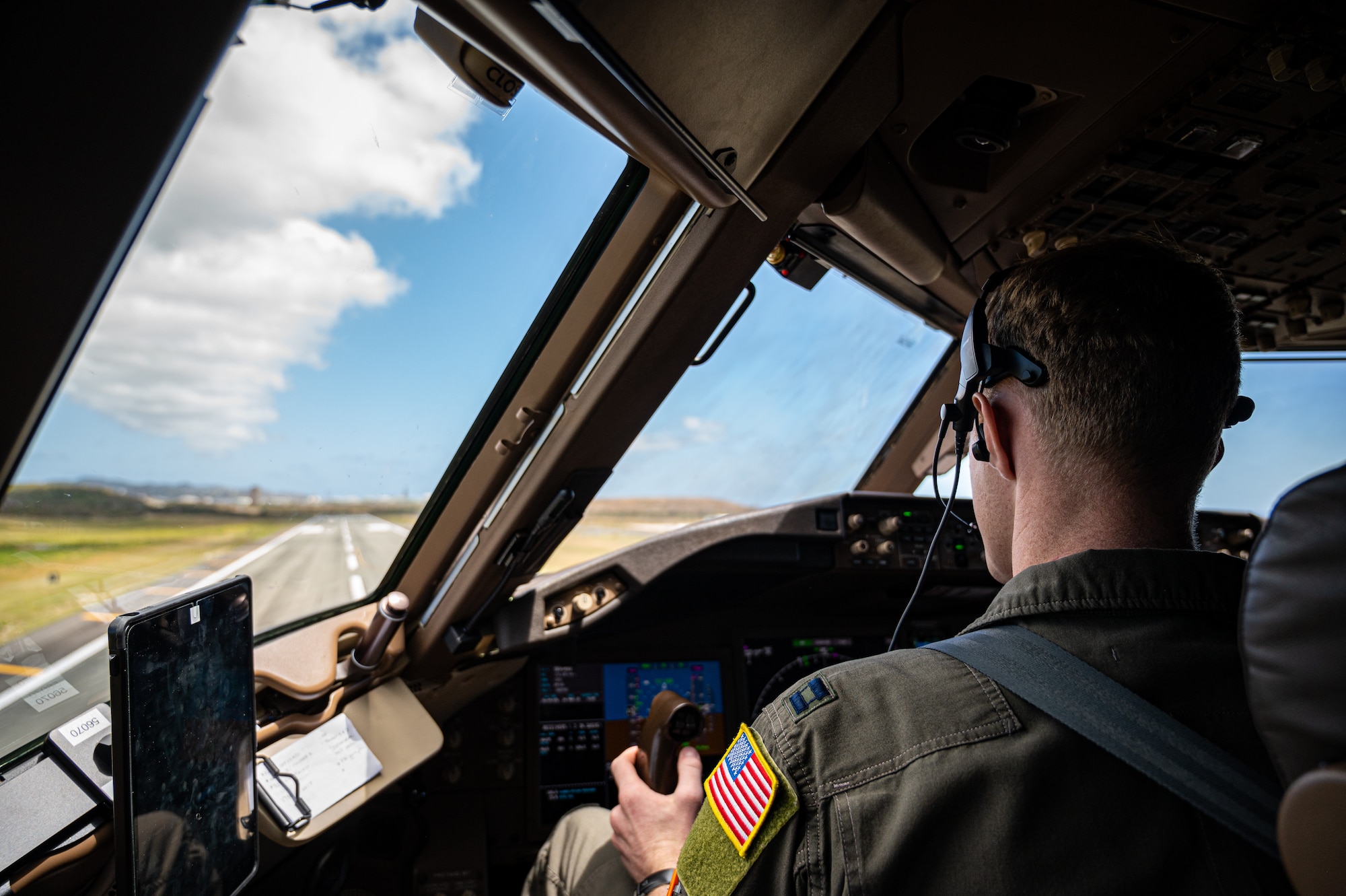 U.S. Air Force Capt. Pete Scherer, 305th Air Mobility Wing pilot, looks out of the cockpit during takeoff for a Bomber Task Force mission at the Henry E. Rohlsen Airport in Saint Croix, U.S. Virgin Islands, March 24, 2023. This mission is another example of accelerating KC-46A Pegasus employment and building interoperability with partner nations while enabling the capability to execute strategic deterrence. As a force multiplier, the KC-46 provides lethality and additional options to project and connect the Joint Force, while extending the operational reach of airpower. (U.S. Air Force photo by Senior Airman Sergio Avalos)