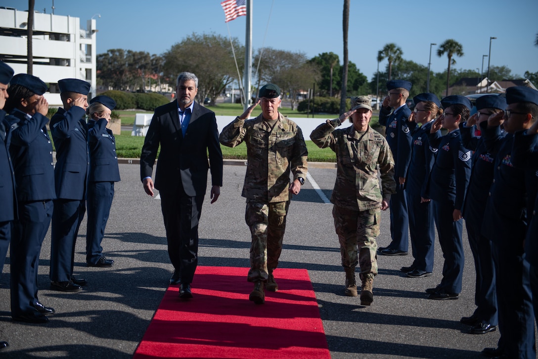 Paraguayan President Mario Abdo Benítez, Army Gen. Bryan Fenton, commander of U.S. Special Operations Command, and Army Gen. Laura Richardson, commander of U.S. Southern Command, arrive at SOCOM headquarters March 30, 2023.