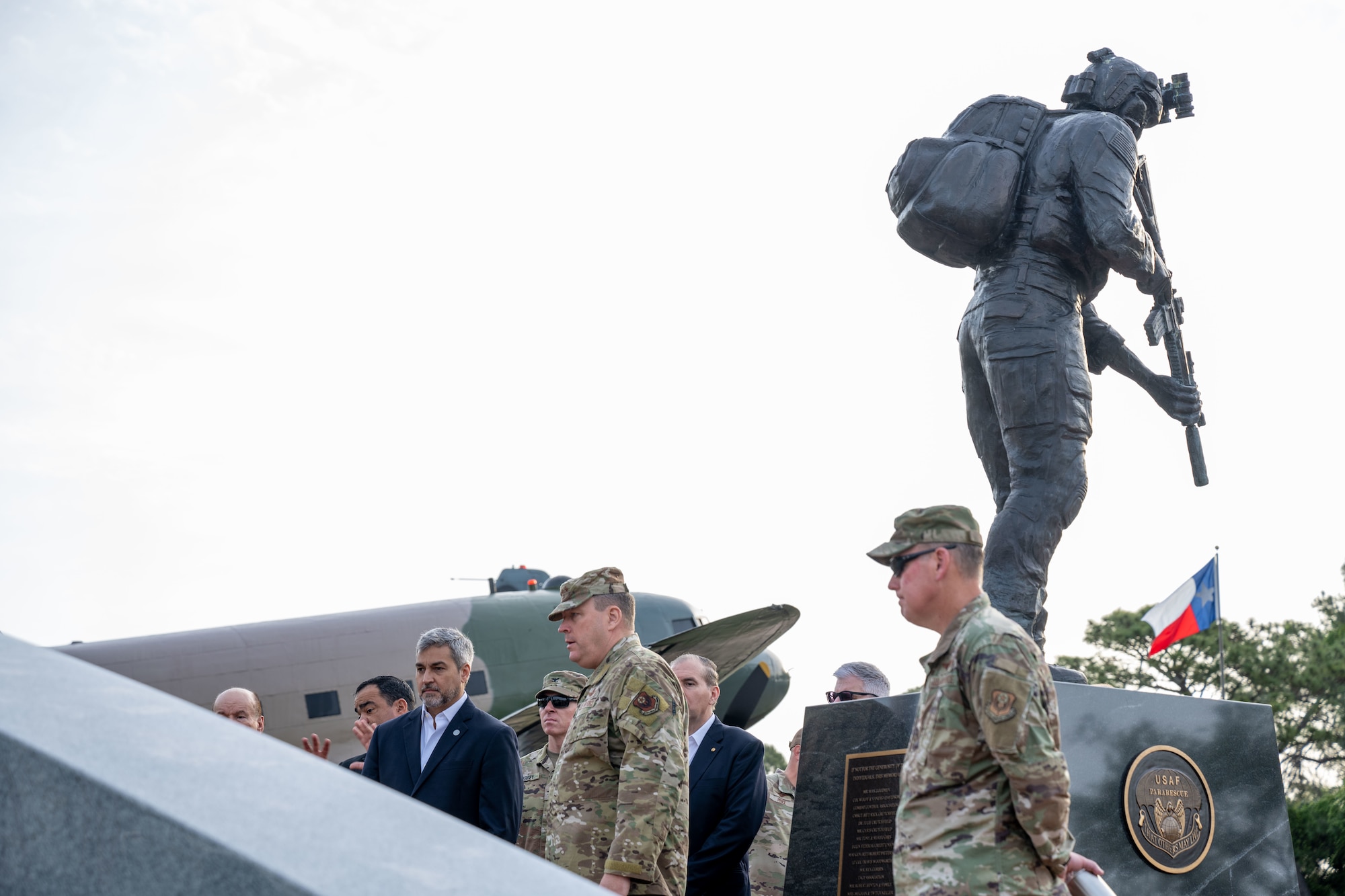 President Mario Abdo Benítez of the Republic of Paraguay tours the Hurlburt Field Memorial Air Park with Lt. Gen. Tony D. Bauernfeind, commander of Air Force Special Operations Command, and Chief Master Sgt. Cory M. Olson, AFSOC command chief, Hurlburt Field, Fla., March 31, 2023.
