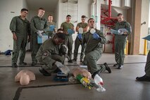 U.S. Marine Corps Gunnery Sgt. David Waterfield, a training officer with Aircraft Rescue Firefighting, Marine Corps Air Station Kaneohe Bay, instructs students on medical response techniques during an emergency medical responder course, Marine Corps Base Hawaii, March 22, 2023. This is the first EMR course in the Marine Corps, and the MCAS ARFF is the first and only unit in the Marine Corps to be recognized by the National Registry of Emergency Technicians to create its own Emergency Medical Services program. (U.S. Marine Corps photo by Cpl. Holly Moore)