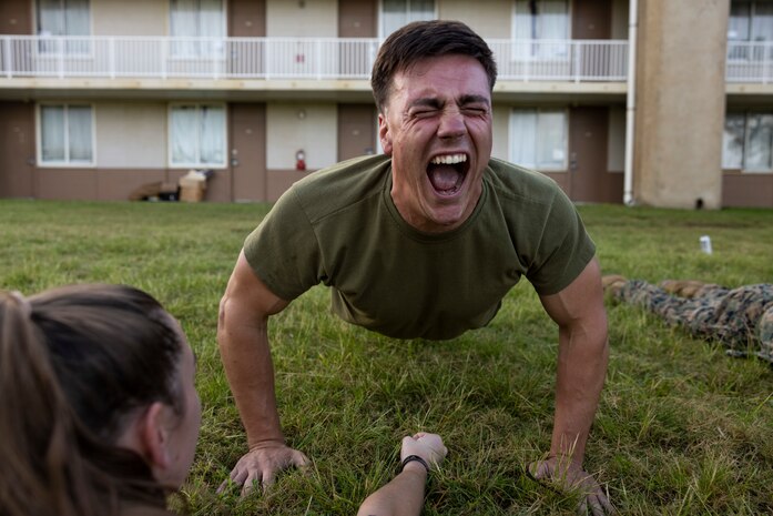 U.S. Marine Corps Sgt. Joseph Hess, an optics technician with Headquarters Company, 3d Marine Littoral Regiment, conducts push-ups during the 3d Reconnaissance Battalion Screening Team Hawaii Roadshow, Marine Corps Base Hawaii, March 23, 2023. The physical screening test evaluated, assessed and selected Marines potentially capable of earning the reconnaissance military occupational specialty. (U.S. Marine Corps photo by Cpl. Samantha Sanchez)