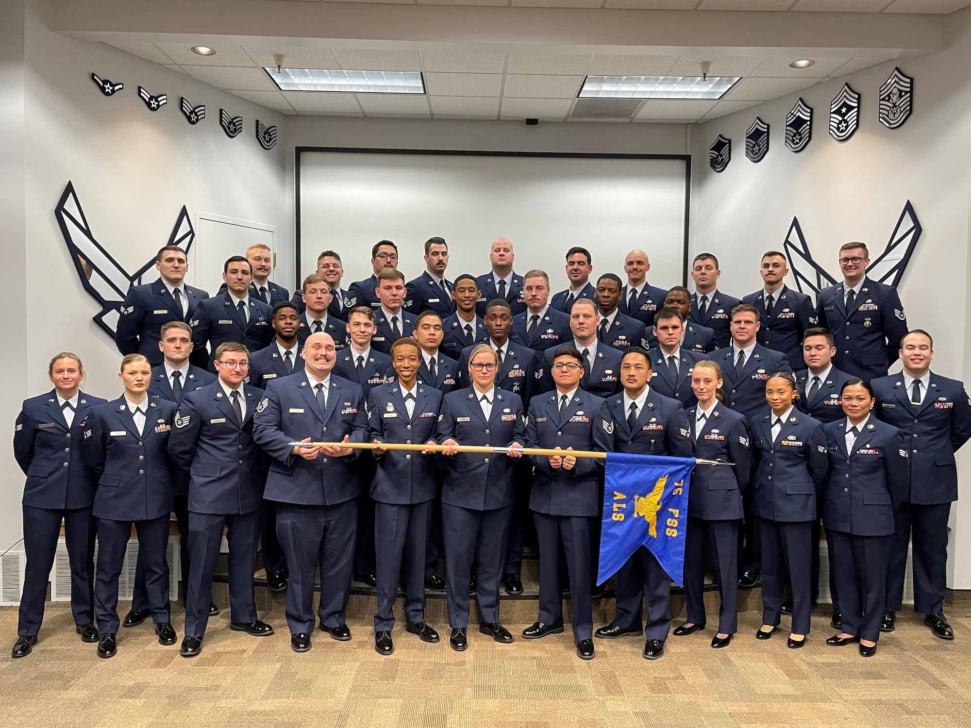 Airmen standing in dress blues