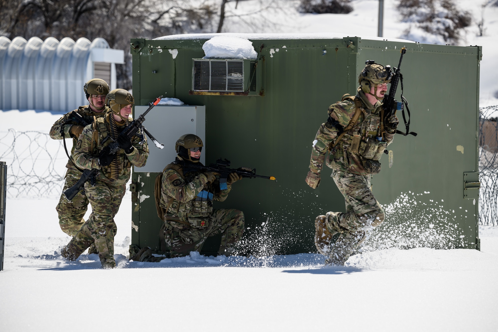 Defenders with the 75th Security Forces Squadron respond to an opposing force attack during a training exercise at Hill Air Force Base, Utah, March 28, 2023. The squadron conducted a series of near-peer adversary field training exercises in the Base Operations Readiness Area from March 18-28. (U.S. Air Force photo by R. Nial Bradshaw)