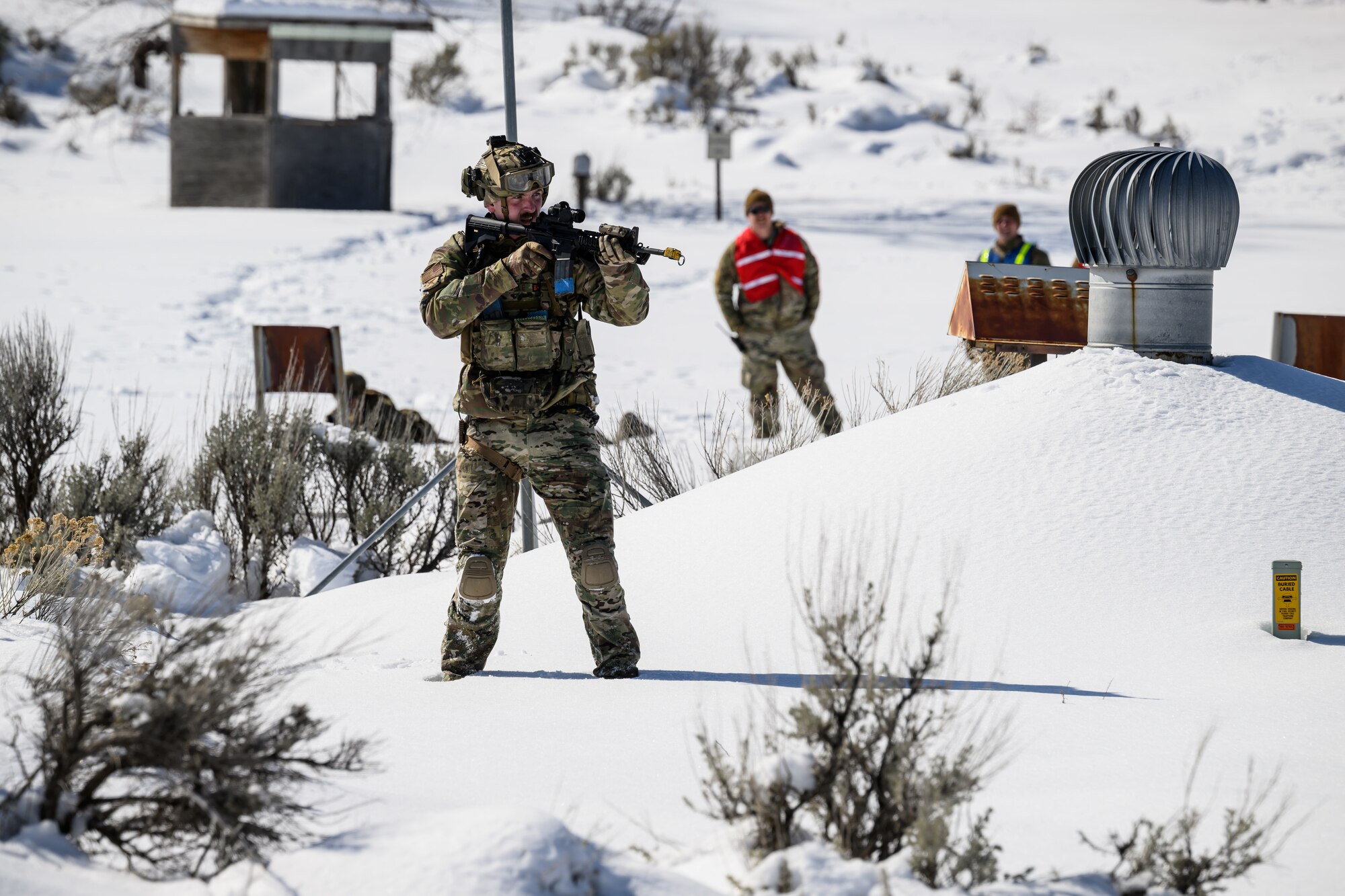 Staff Sgt. Jamison Sample, 75th Security Forces Squadron, searches for opposing forces during a training exercise at Hill Air Force Base, Utah, March 28, 2023. The squadron conducted a series of near-peer adversary field training exercises in the Base Operations Readiness Area from March 18-28. (U.S. Air Force photo by R. Nial Bradshaw)