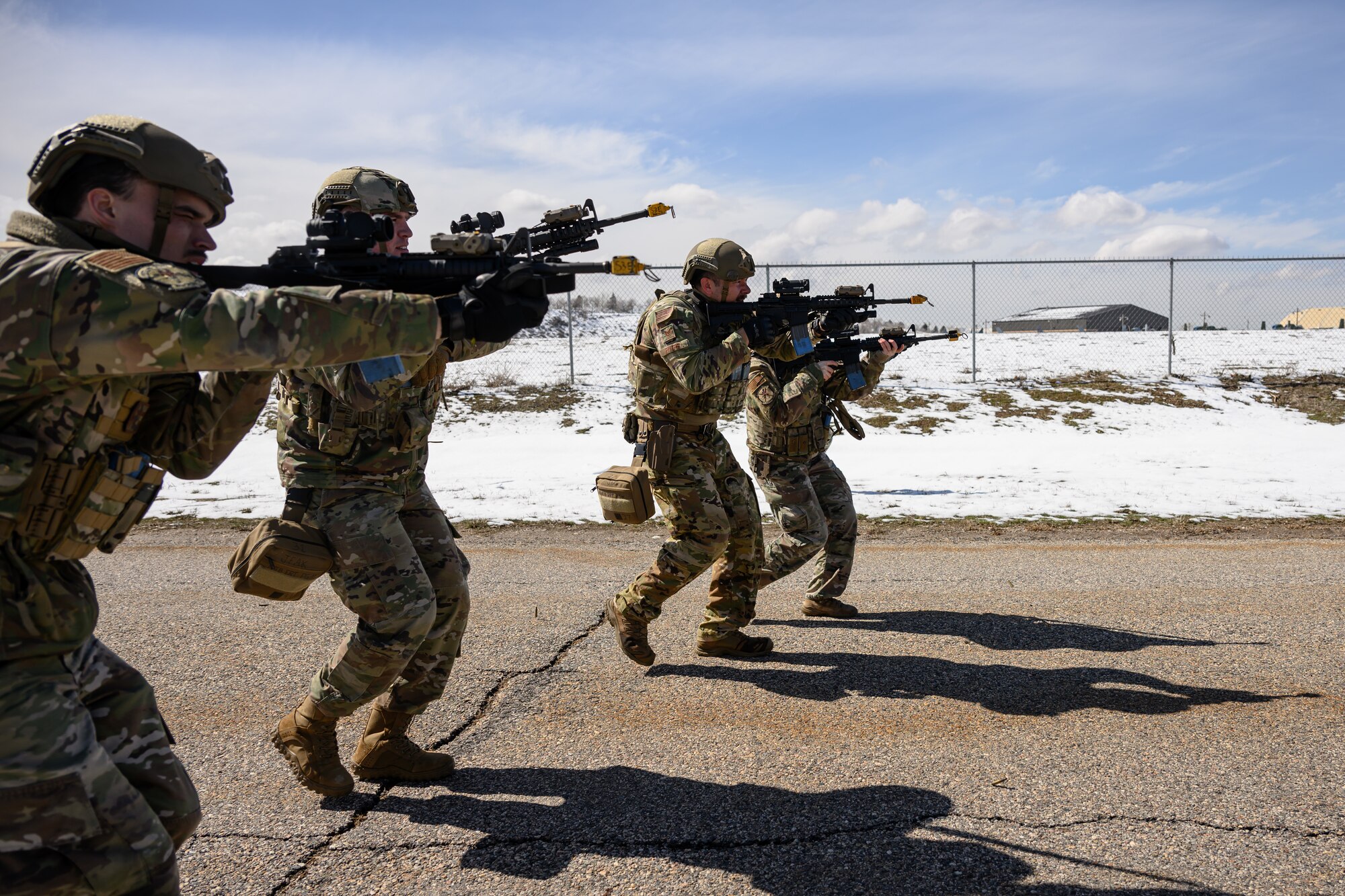 Defenders with the 75th Security Forces Squadron engage opposing forces during a training exercise at Hill Air Force Base, Utah, March 21, 2023. The squadron conducted a series of near-peer adversary field training exercises in the Base Operations Readiness Area from March 18-28. (U.S. Air Force photo by R. Nial Bradshaw)