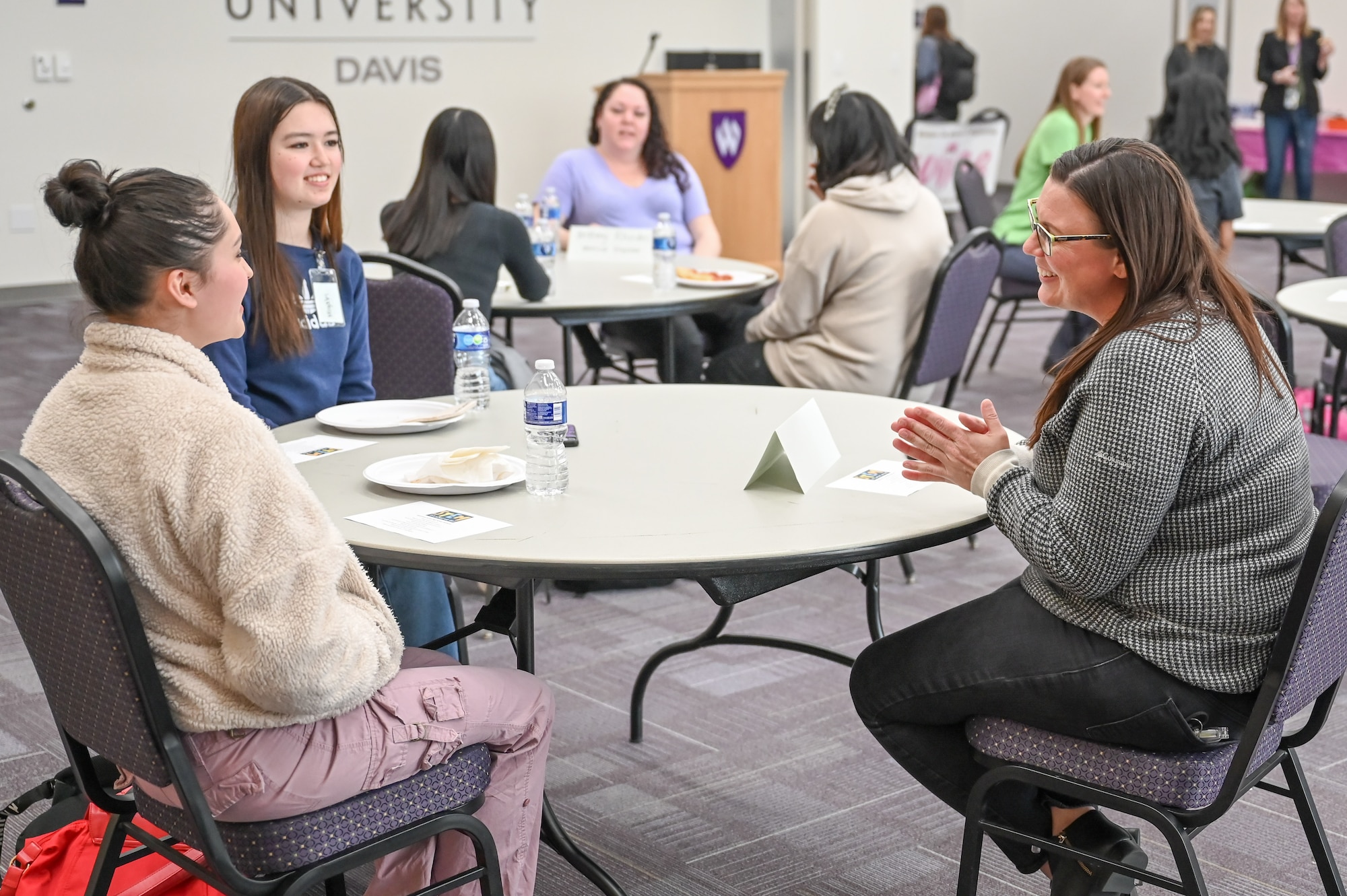 Jen Crouch, 520th Software Engineering Squadron at Hill Air Force Base, Utah, meets with female high school students from NUAMES High School in Layton, during a Science, Technology, Engineering and Math (STEM) event March 30, 2023.