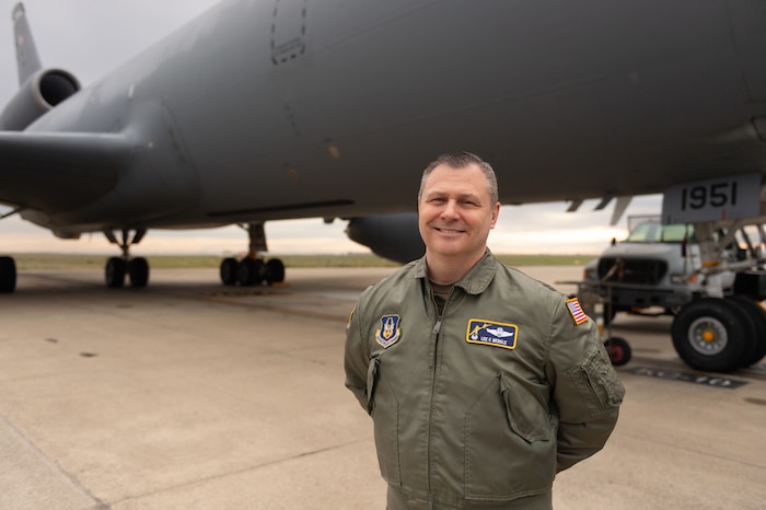 Col. Lee Merkle, 349th Air Mobility Wing commander, is pictured with the KC-10A Extender known as 1951 before she flies out from Travis AFB one final time.