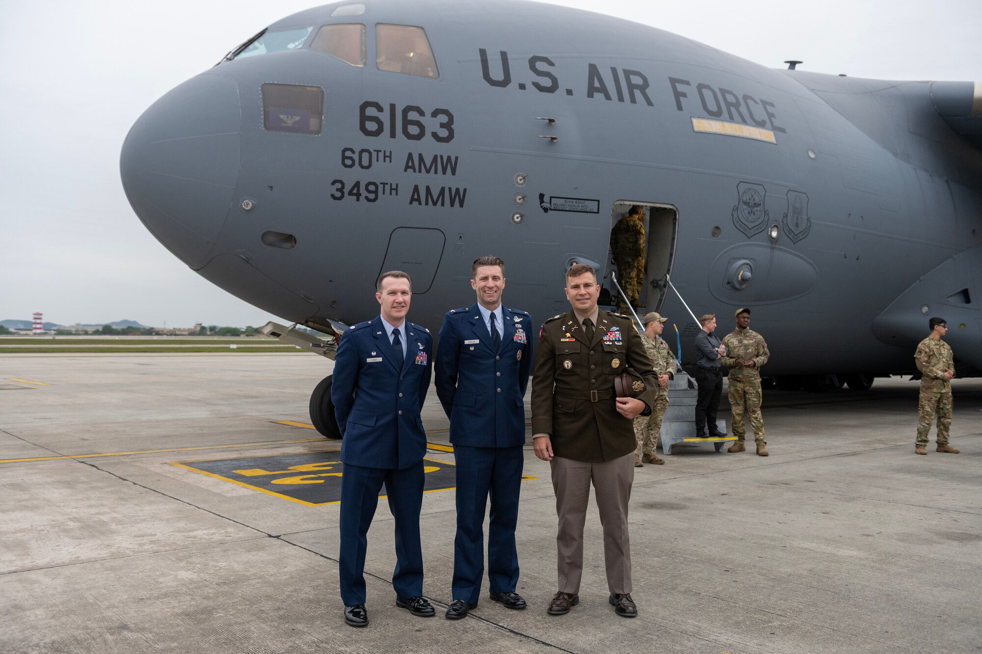 U.S. service members in front of U.S. Air Force C-17